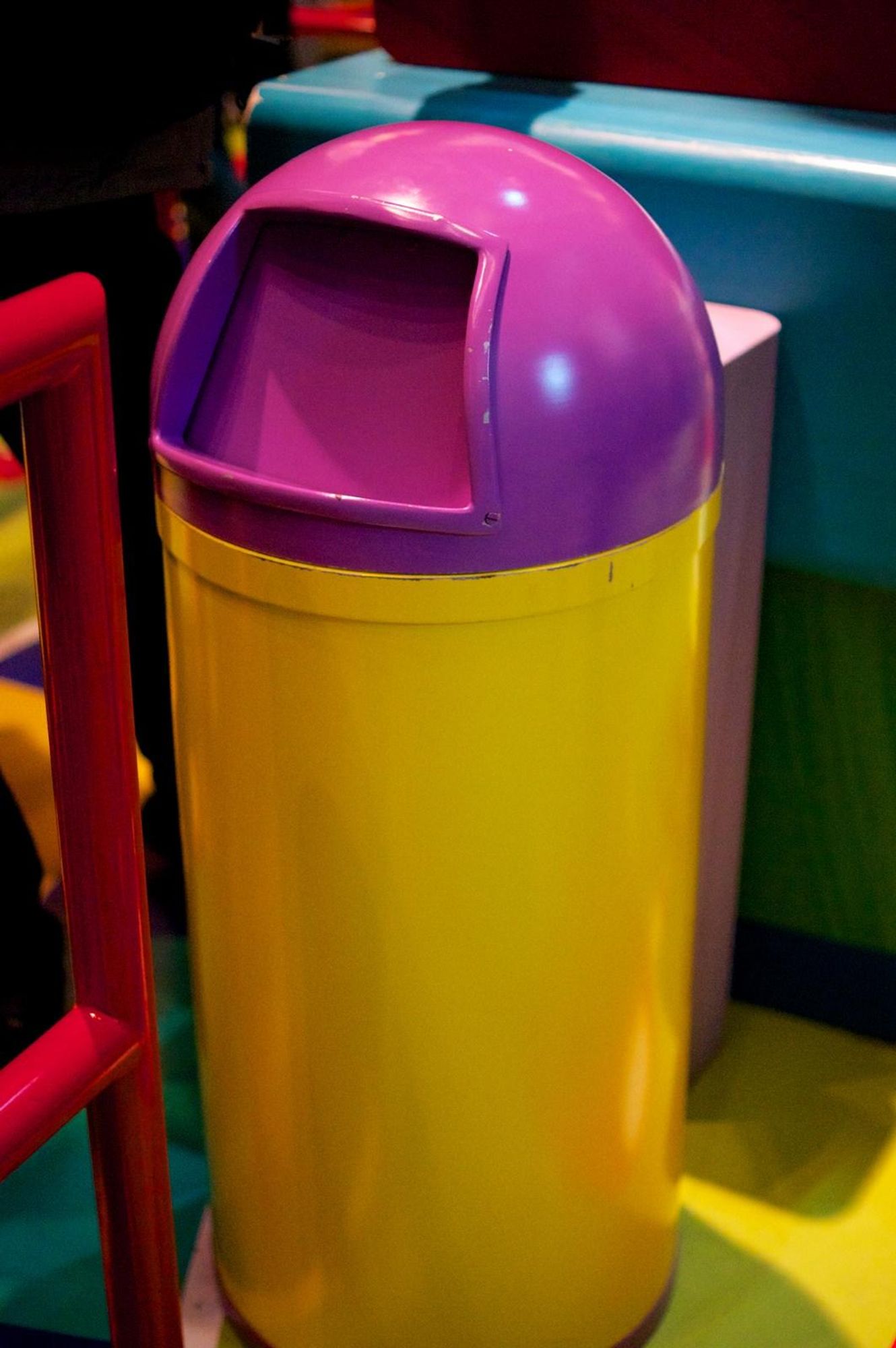 Bullet-style trash can with purple and yellow colors 