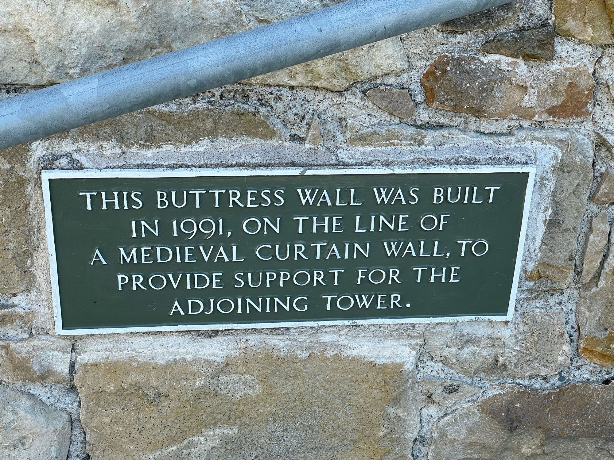 Sign at Spynie: “This buttress wall was built in 1991, on the line of a medieval curtain wall, to provide support for the adjoining tower.”