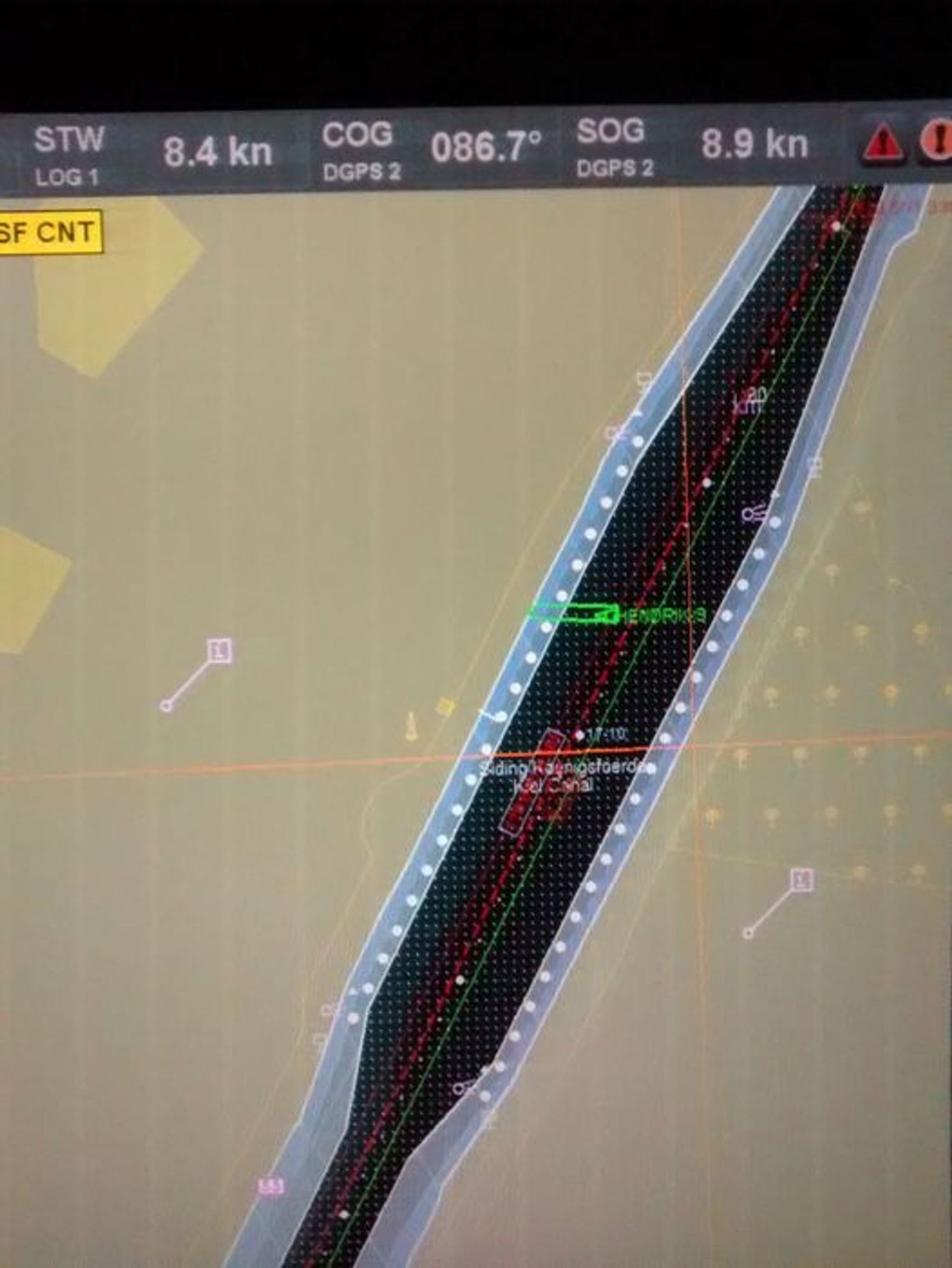 A ship's electronic chart showing a narrow canal with a ship sticking into one bank.