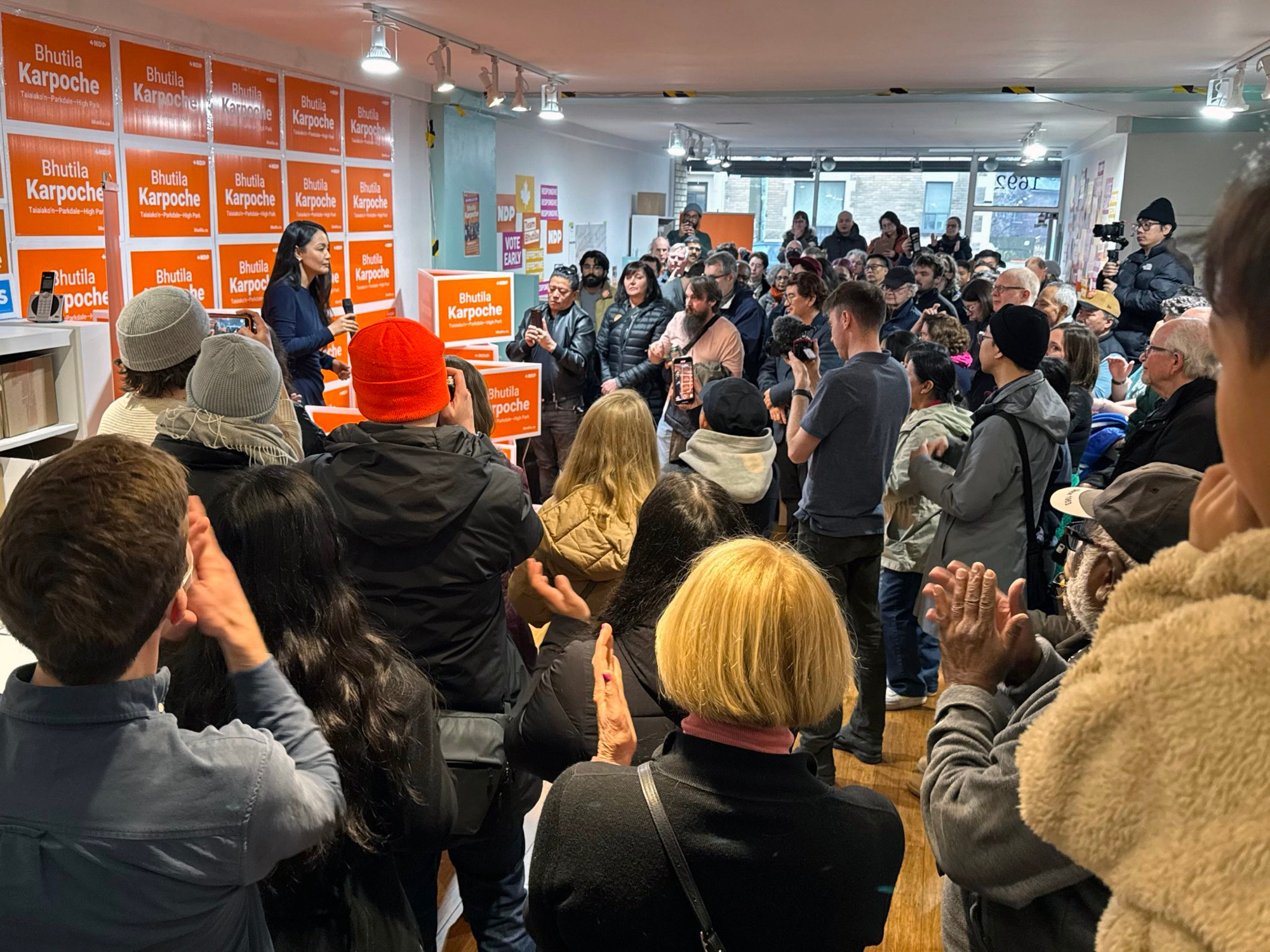 Bhutila Karpoche speaking to a packed crowed in her campaign office.