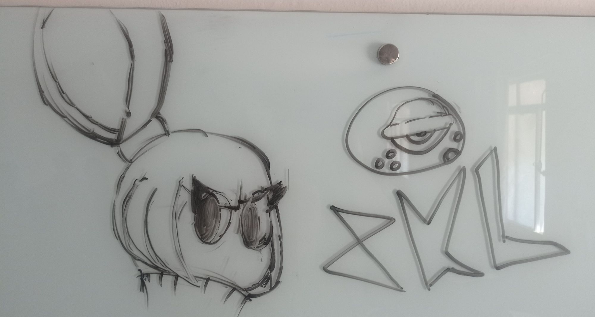 The board is transparent and the pen was almost out of ink, but I managed to make my characters Misa and Blob, along with the signature "ZKL".