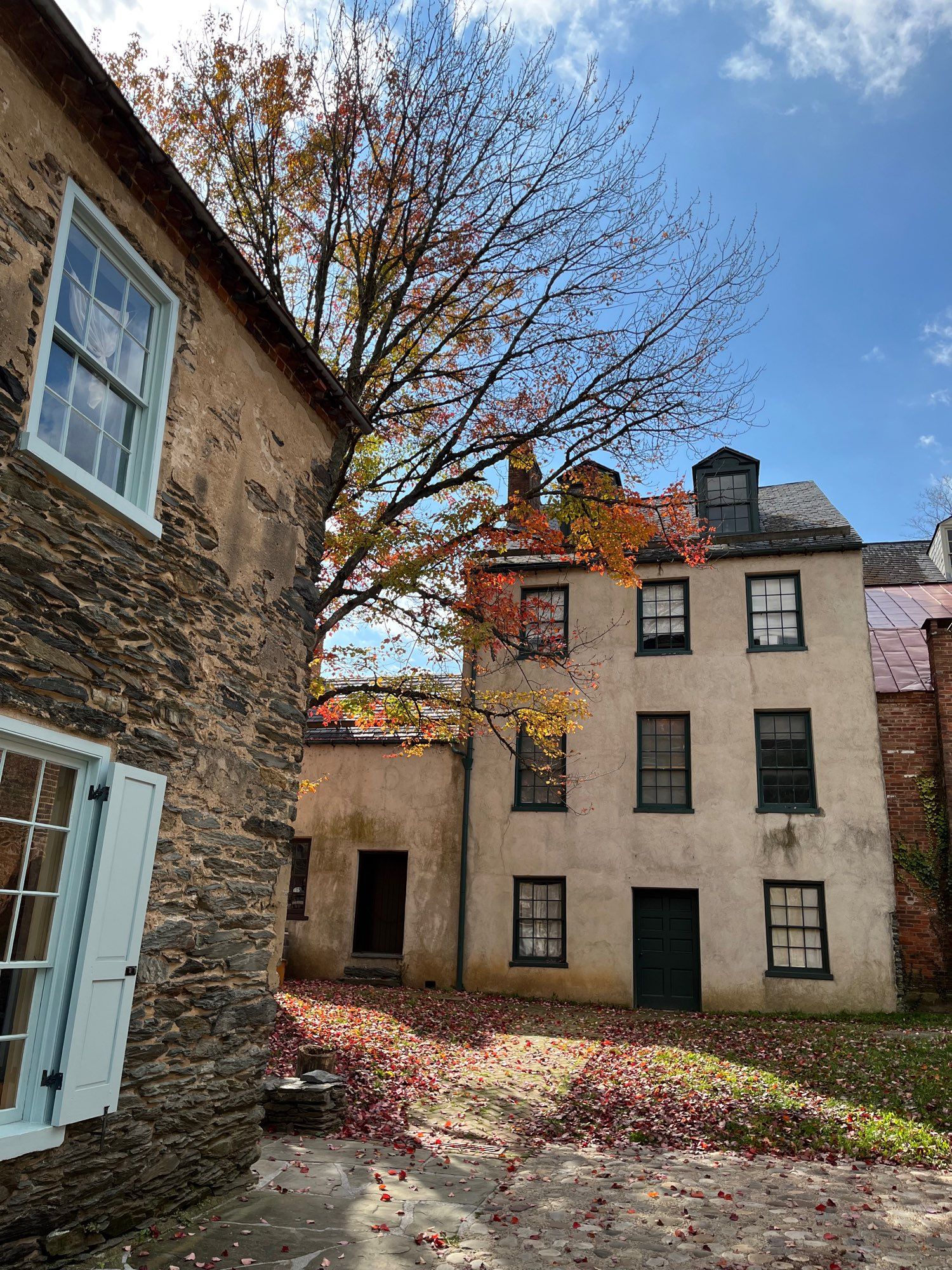 Colonial building with fall foliage