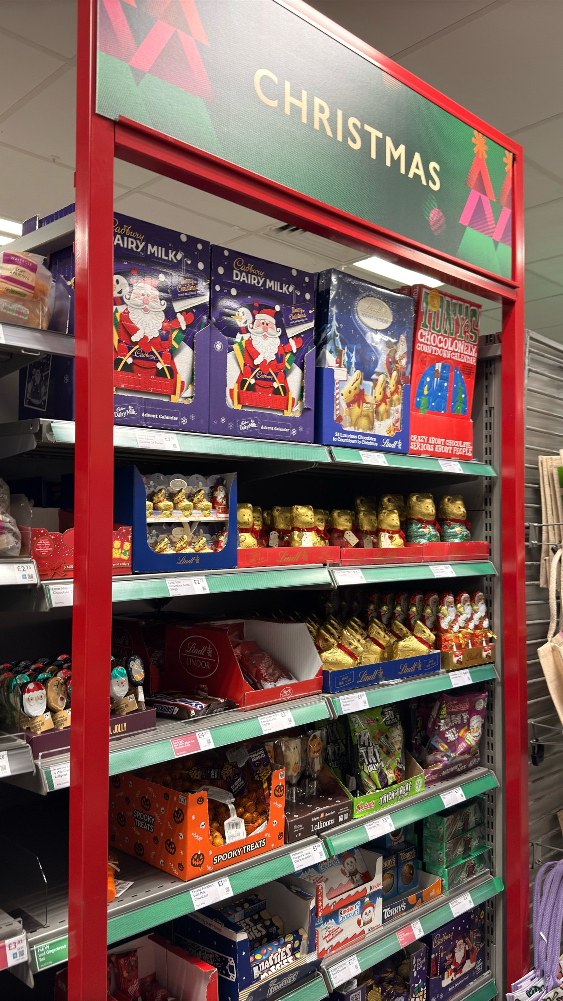 A display full of Christmas chocolates in Waitrose, including advent calendars.