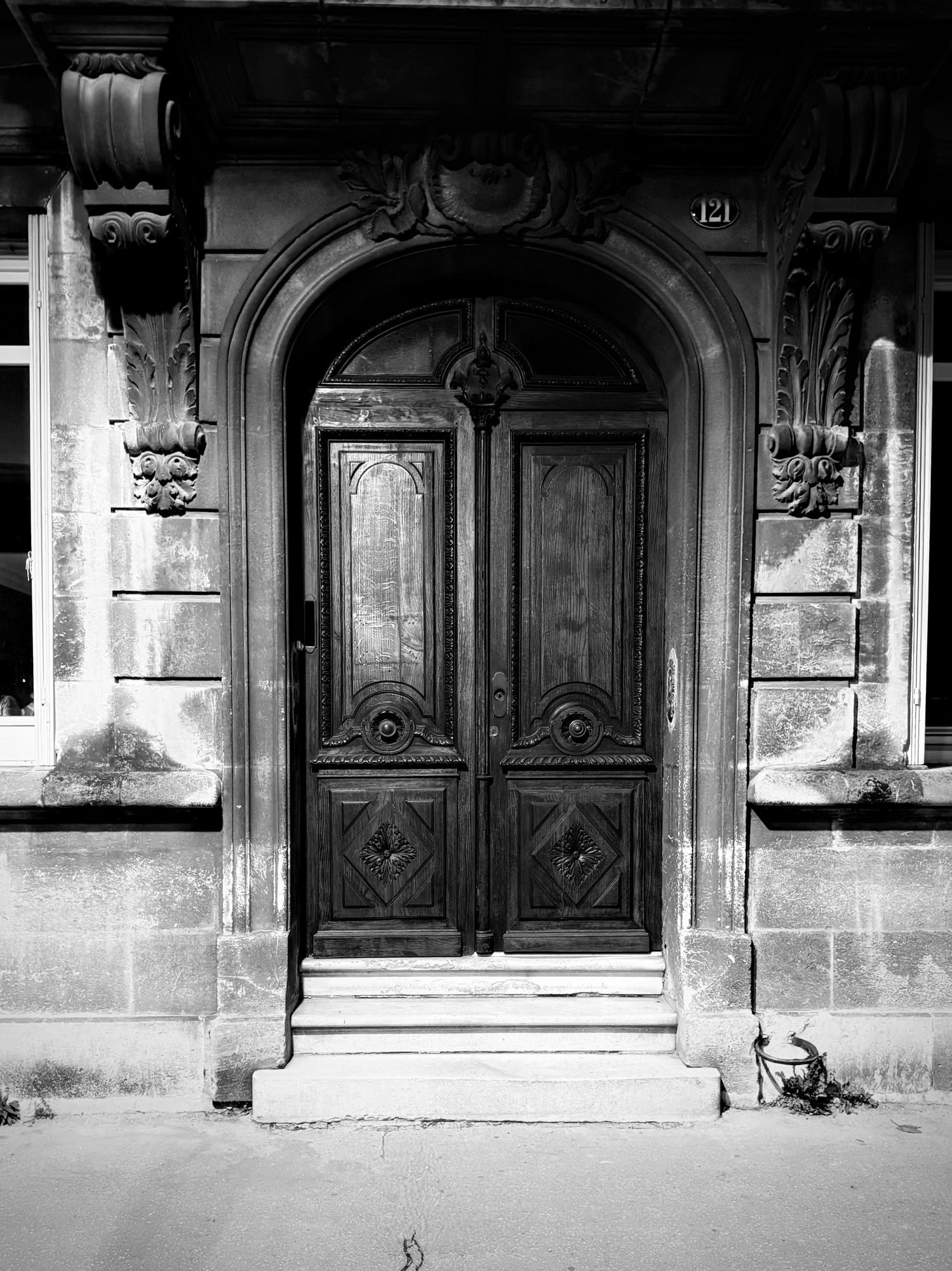 Street side double doors at night.