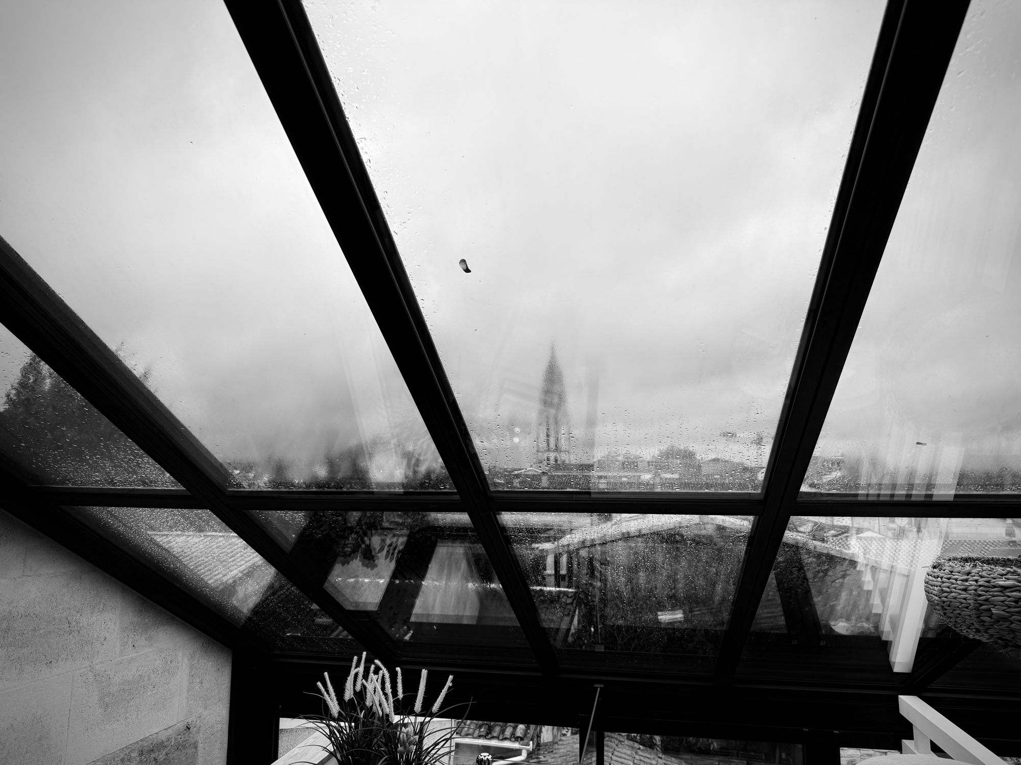 Gloomy black and white photo of rain clouds over Bordeaux.