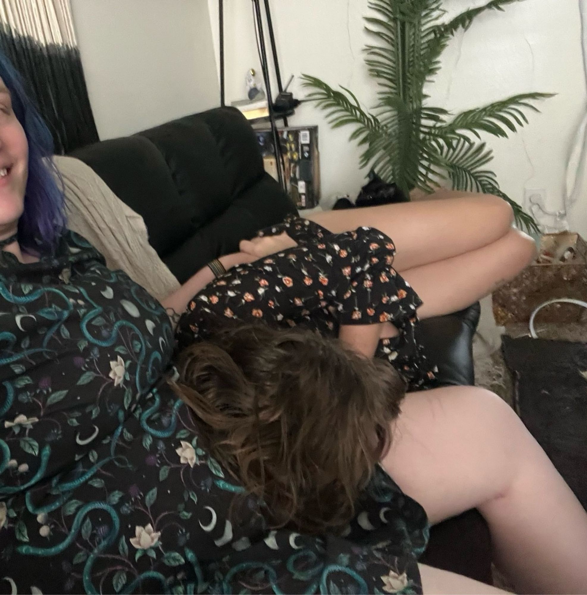 A candid photo of a bksy user by user’s gf.
User’s gf to the left seated upright. User is lying down half-asleep on gf’s lap.