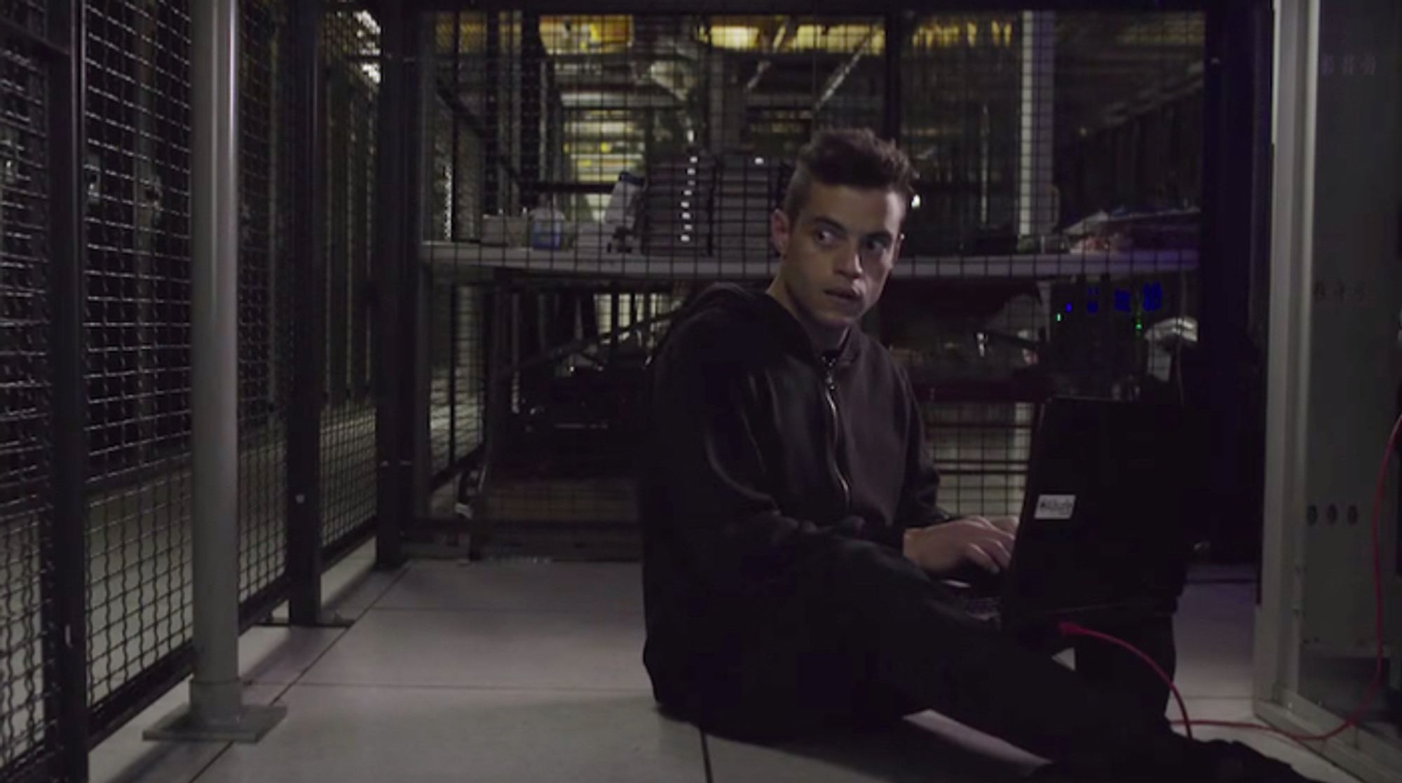 elliot anderson on a laptop in a server room - mr. robot