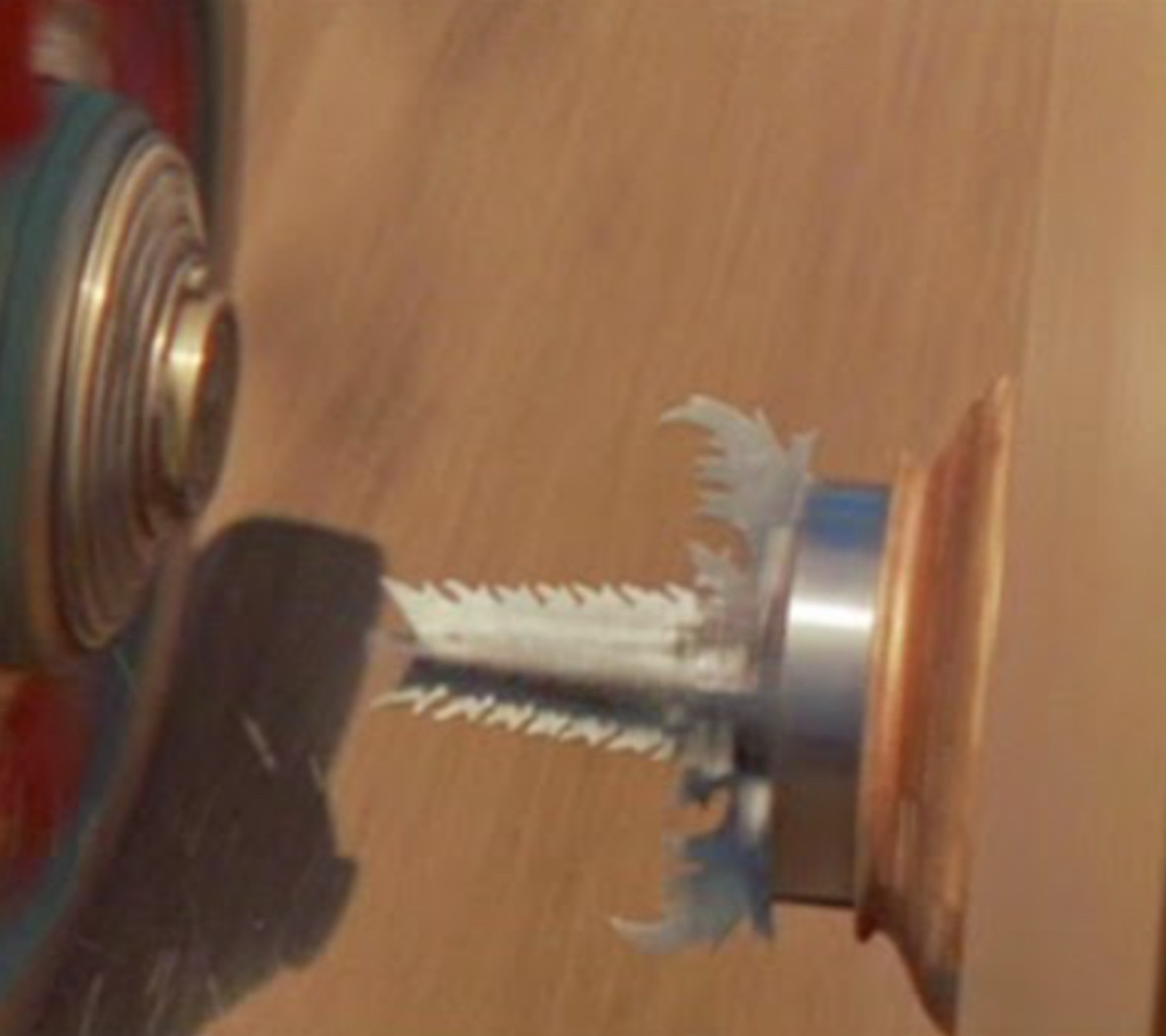 An image of the chariot with drill-like attachments to destroy the wheels of the other chariot in the film Ben Hur