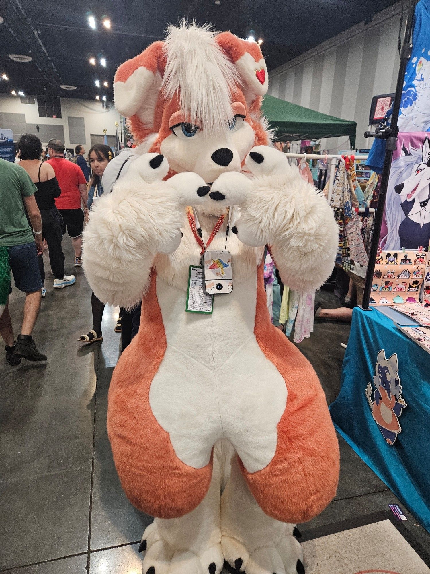 A pink and white canine fursuit.