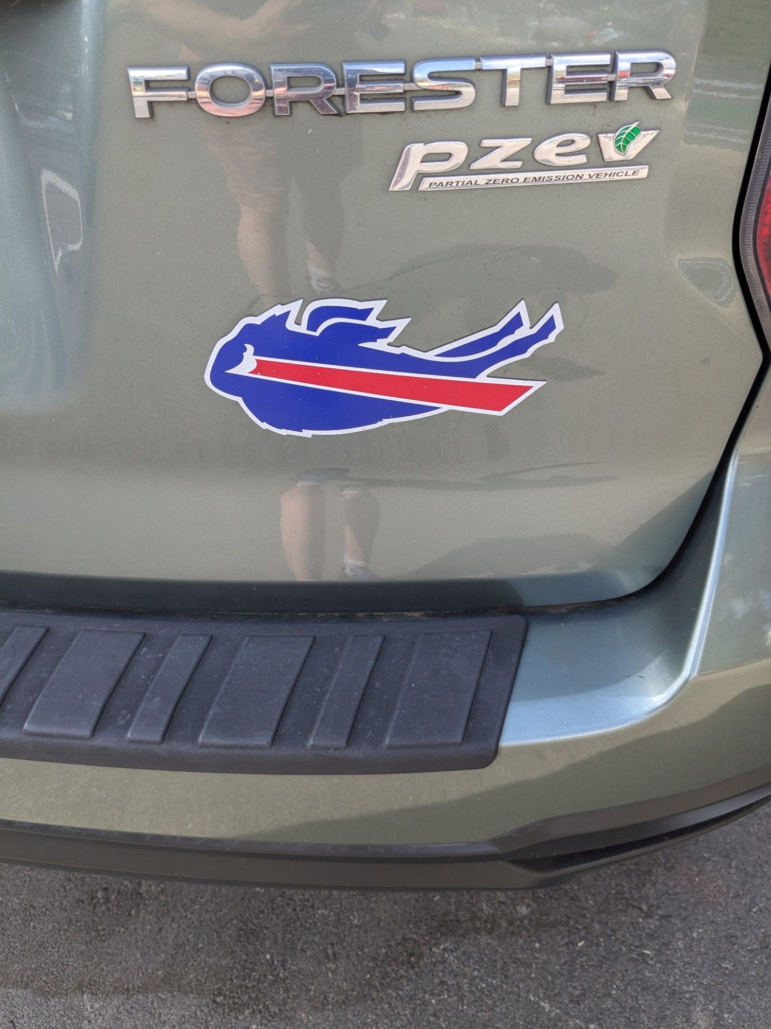 A magnet depicting the Buffalo Bills logo on the rear tailgate of a Subaru Forester, removed and turned upside down by (an) unknown hooligan(s)