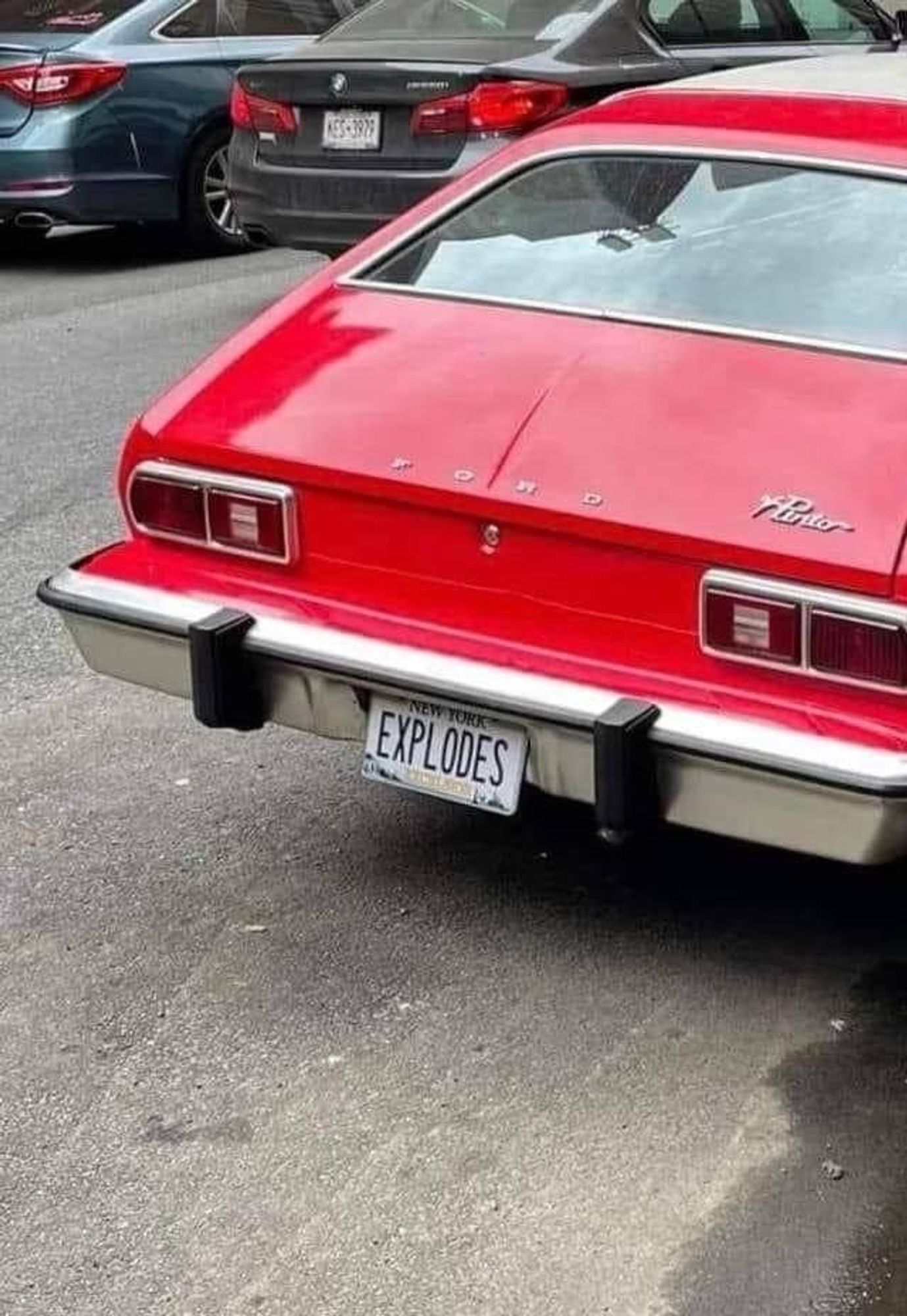 Picture of a Ford Pinto with a license that says, "explodes."