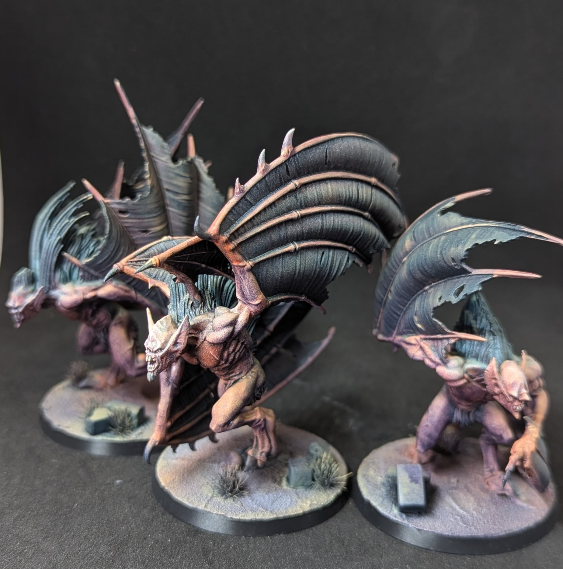 Photo of 3 Vargheist miniature figures from Games Workshop's Age of Sigmar range. They are humanoid monsters with bat wings for arms.