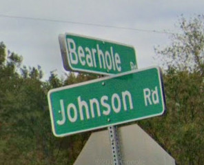 Street signs at the top of a stop sign pole, where Johnson Rd meets Bearhole Rd