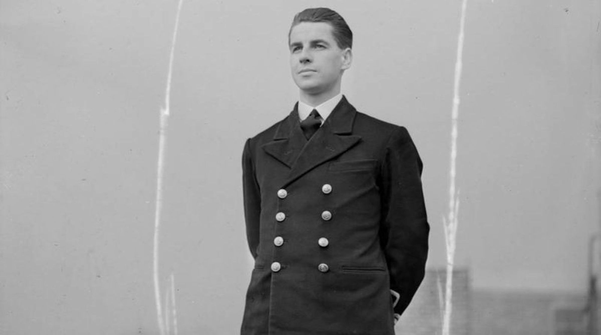 Informal portrait photograph of Ken Hudspeth wearing naval uniform.