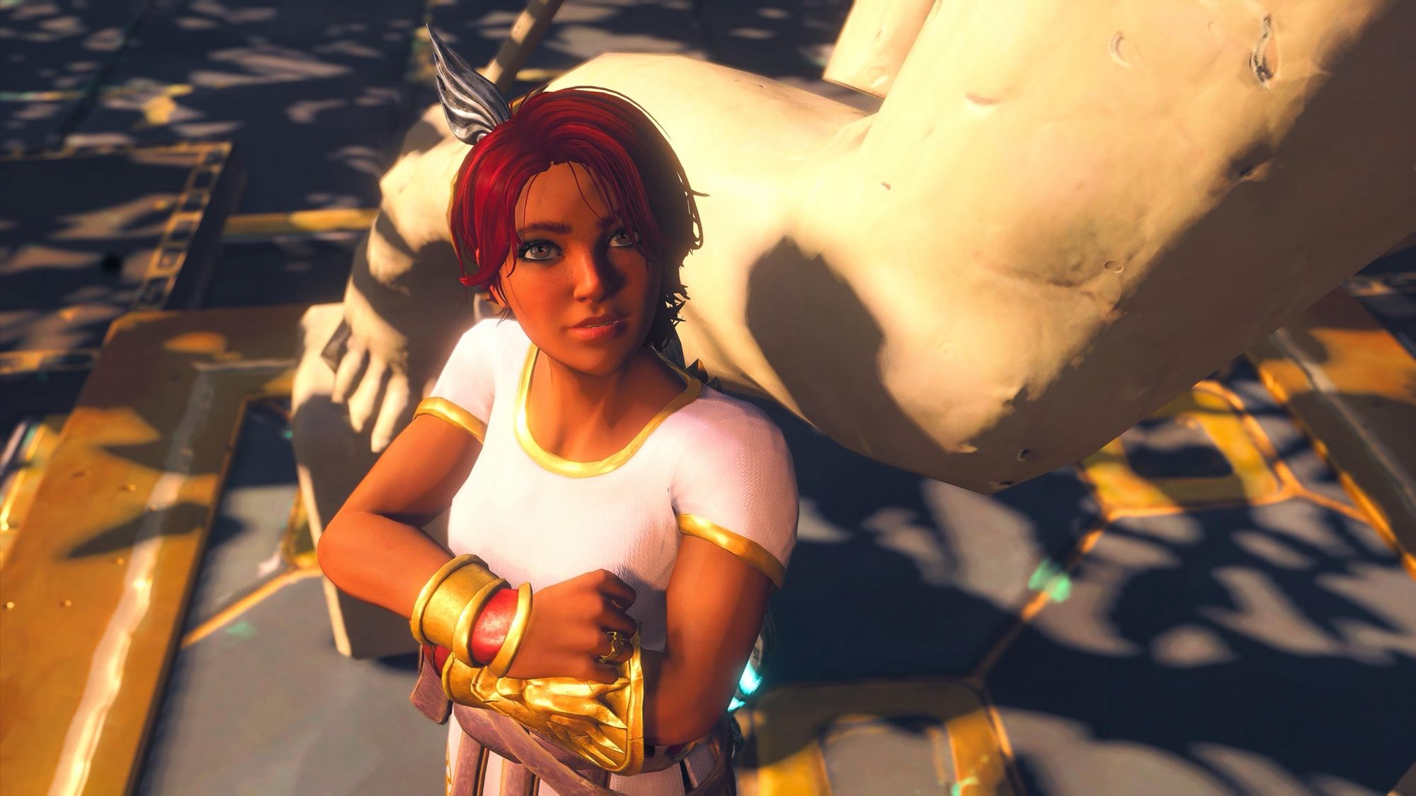 Fenyx - main protagonist of the story - leaning against the leg of Achilles‘ statue. Fenyx is fully customized: red haired girl in a white and gold tunic.