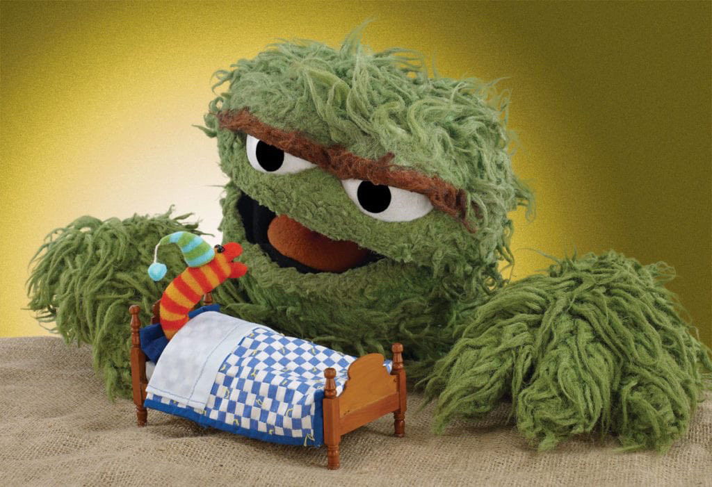 Oscar the Grouch saying goodnight to a little worm