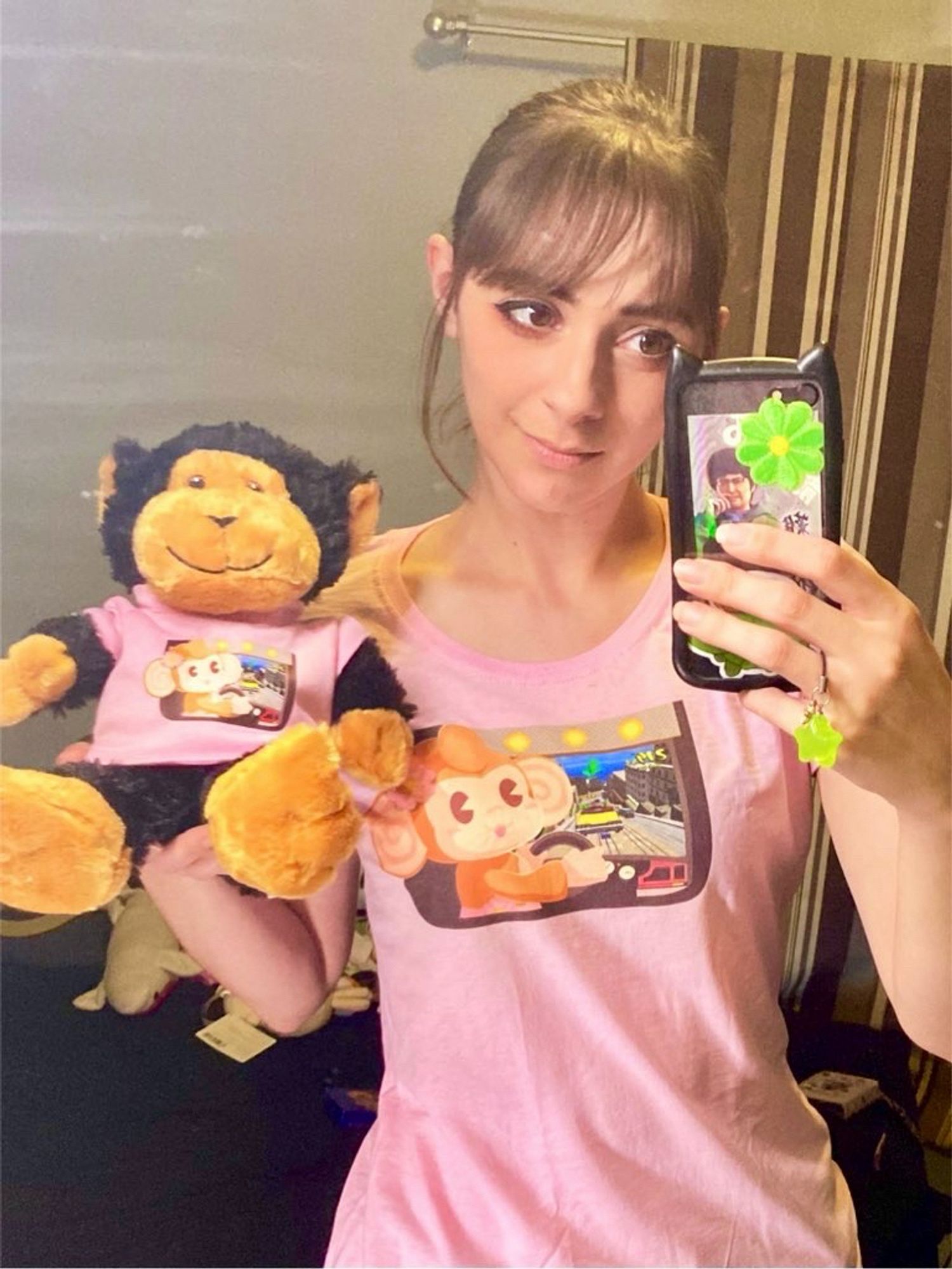 me and a monkey plush wearing matching pink shirts with a drawing i made for SEGAbits Arcade Adventure 3 of classic super monkey ball MeeMee playing crazy taxi arcade