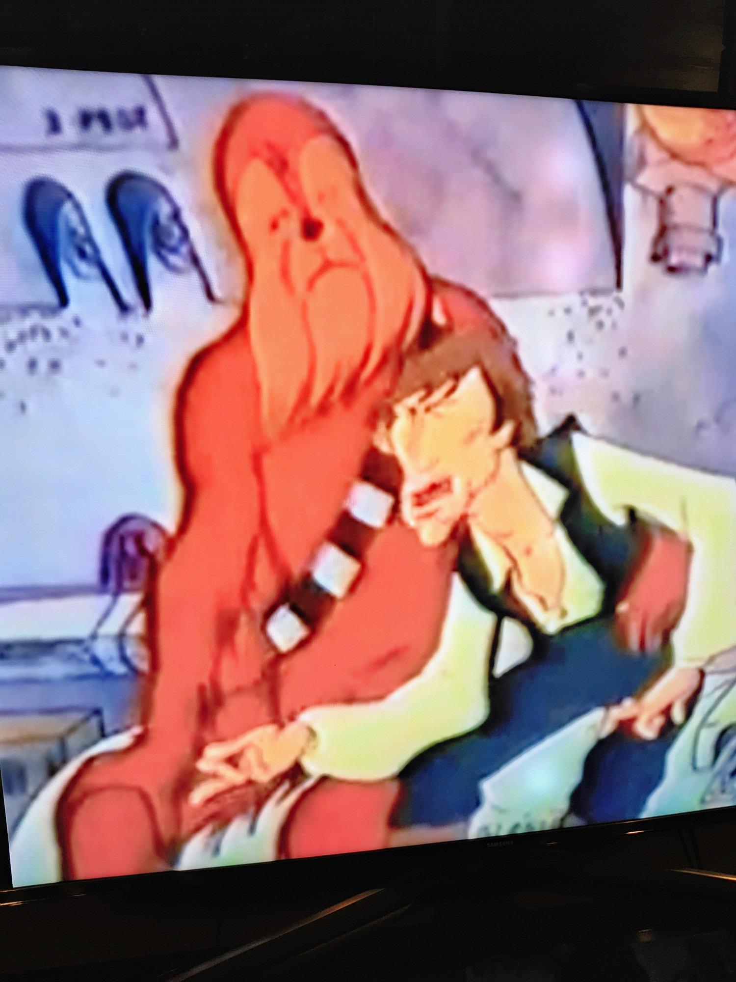 Weird protruding-jaw Han Solo and a just plain wrong and weird Chewbacca from the Star Wars Holiday Special cartoon