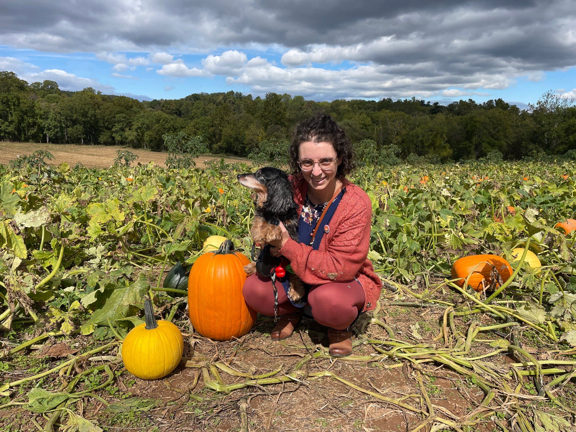 Laura and Pan in a pumpkin patch