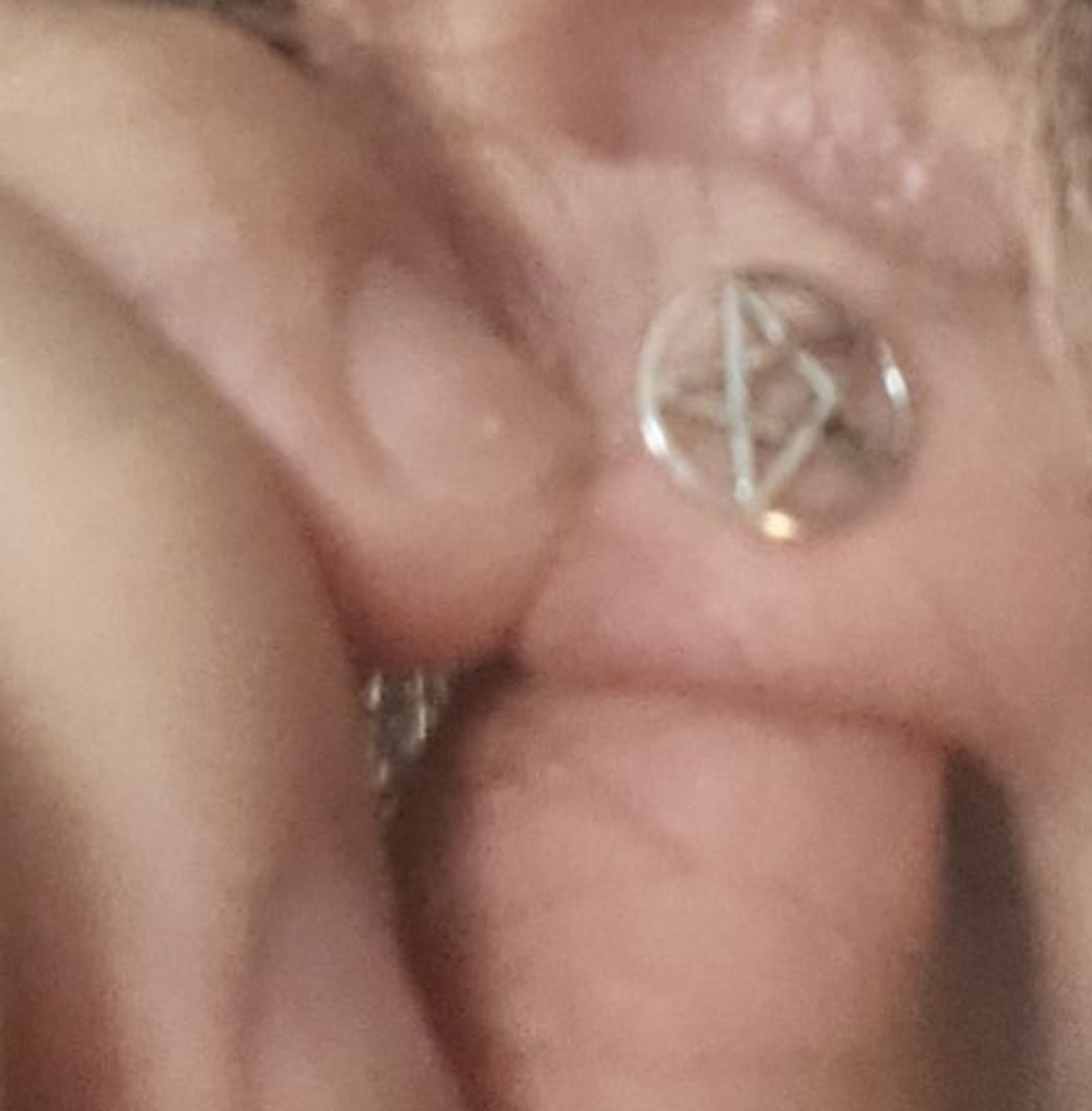 Zoomed in picture on my silver ear cuffs with 5 branches stars