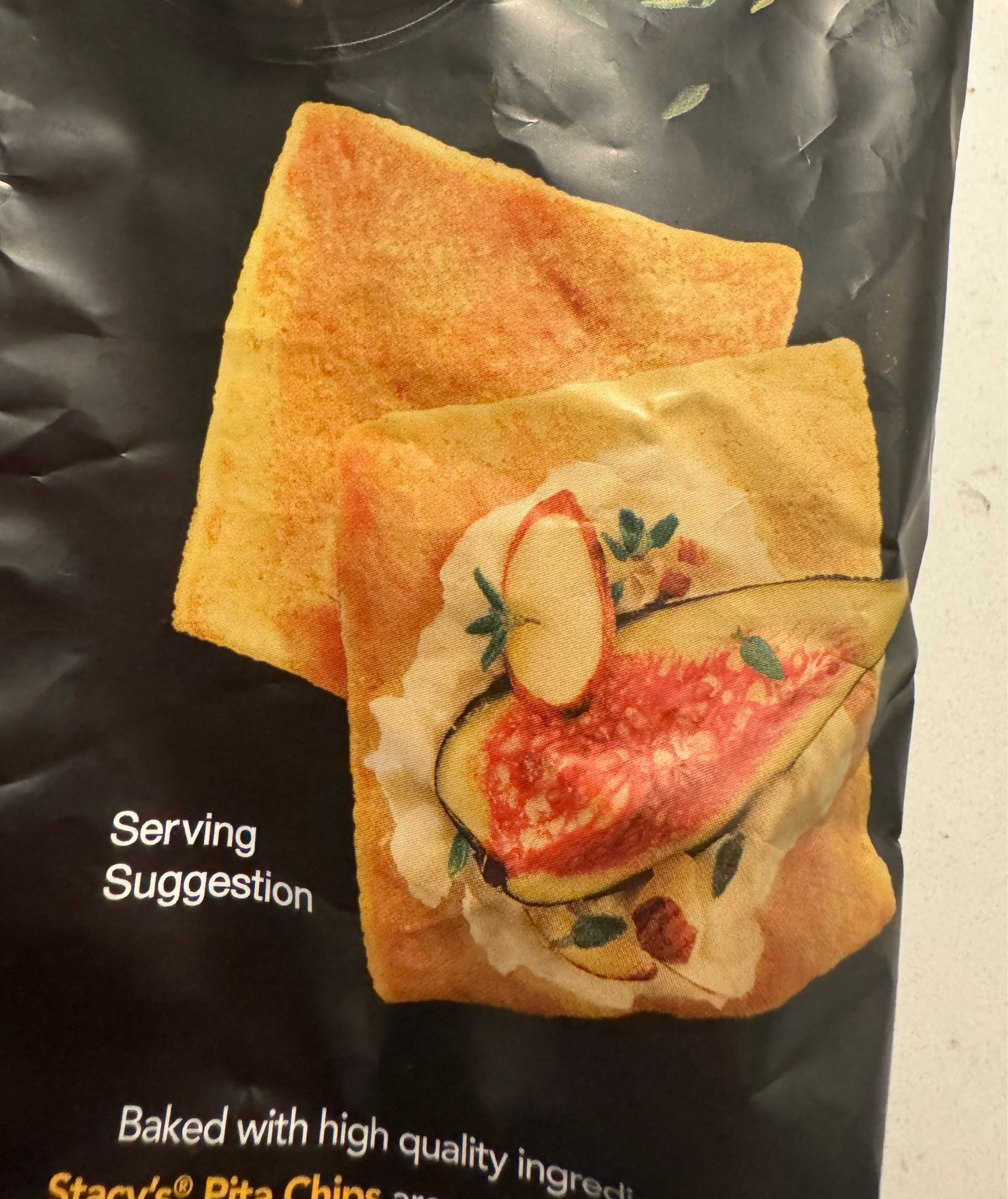 The picture on a bag of Stacy’s pita chips that says “Serving Suggestion” but it’s two dang chips and a bunch of fancy bullshit on only one of them