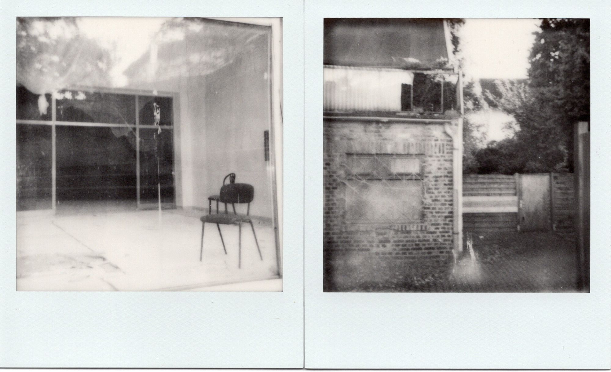 two b/w Polaroids
-a lonely chair inside a large room behind glass
-backalley behind an old brick house