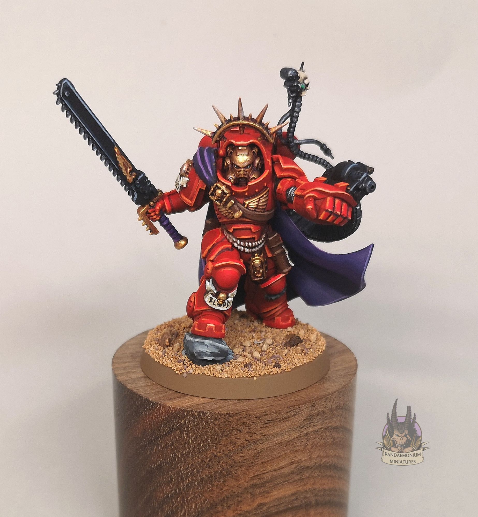 Gravis Captain armed with a relic chainsword and powerfist with wrist mounted bolter