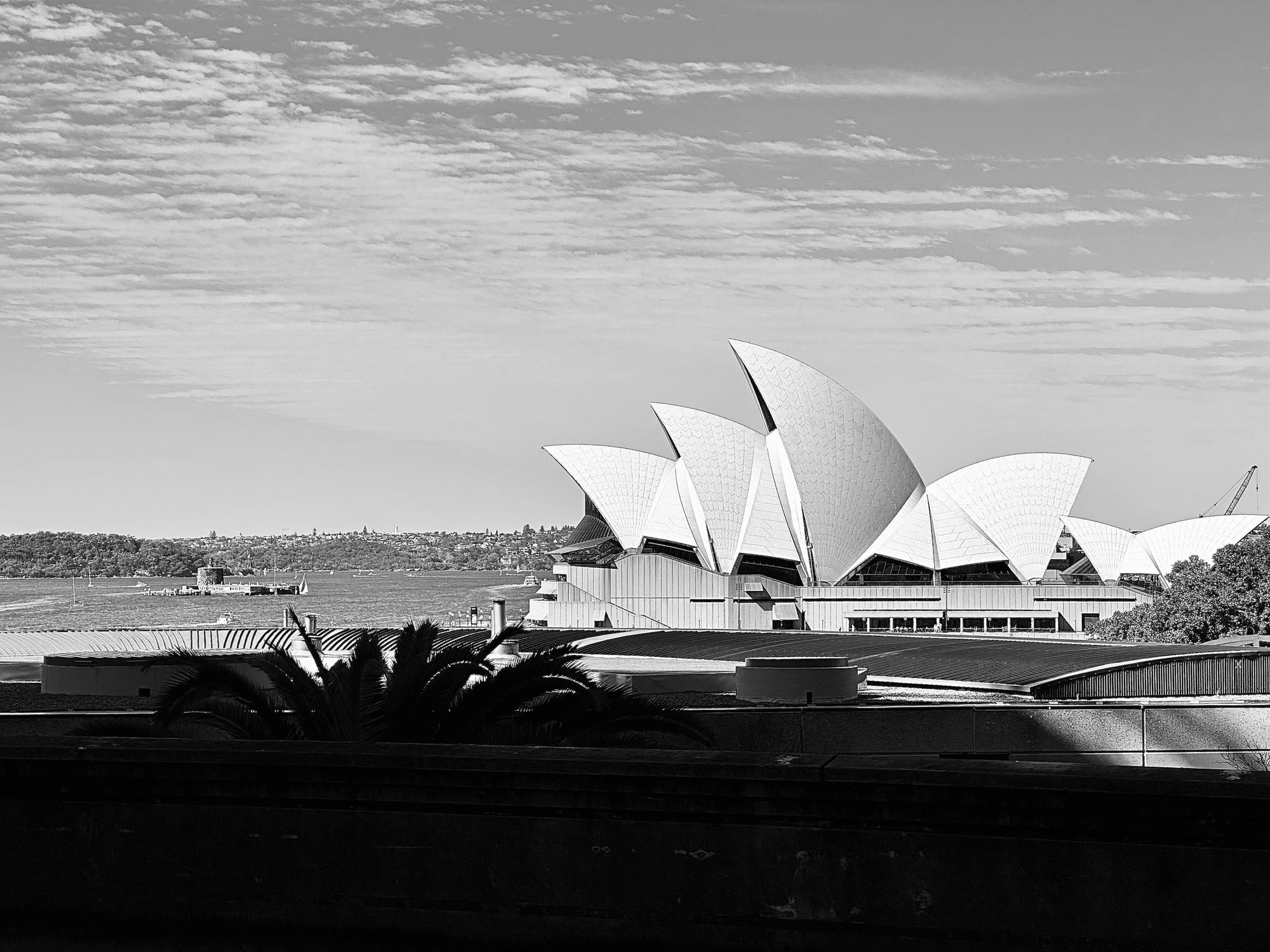 Sydney Opera House viewed from underneath the Sydney Harbour Bridge