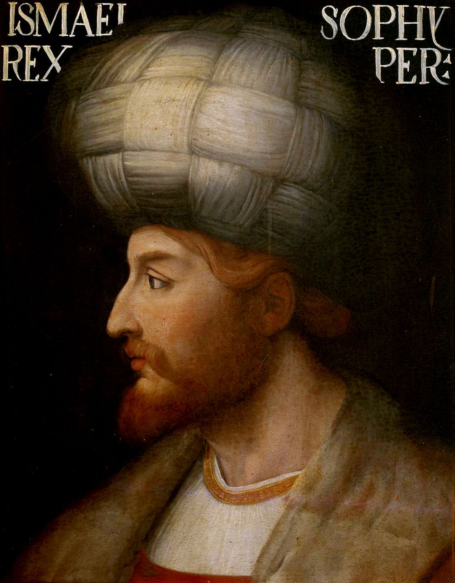 Portrait of Ismail I, first Safavid shah of Iran. He is a pale redheaded man wearing a white turban, facing to the left.