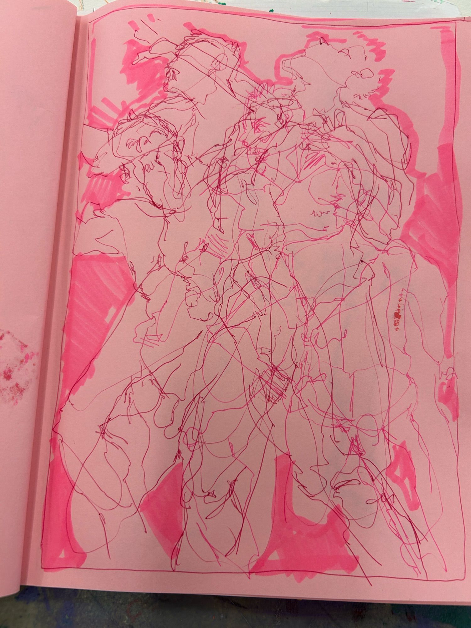 On a pink sketchbook page, red ballpoint pen sketches of a nude man drawn from 2 minute poses, drawn over each other all over each other