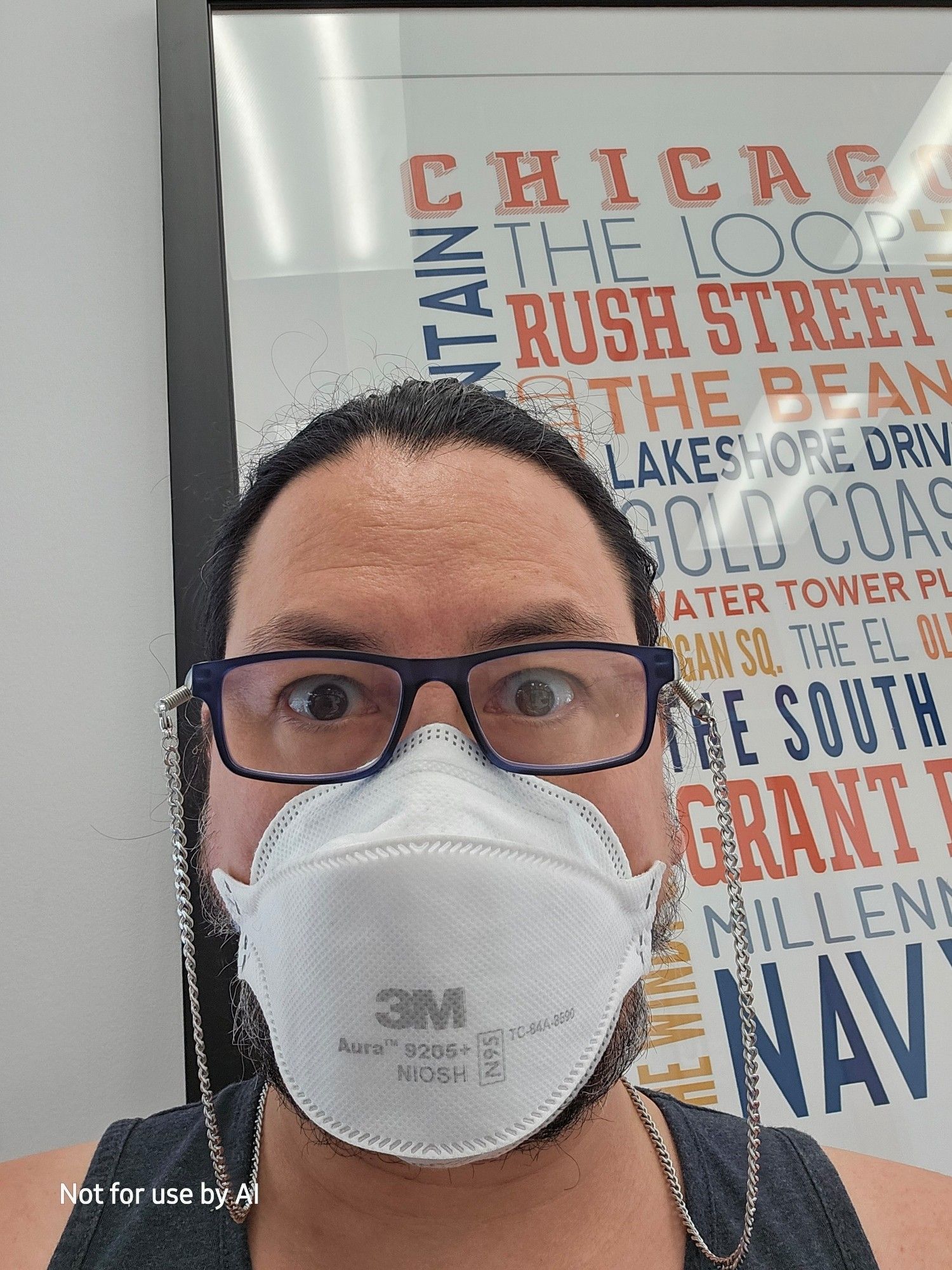 Me wearing a white, 3M N95 mask in an immediate care facility.