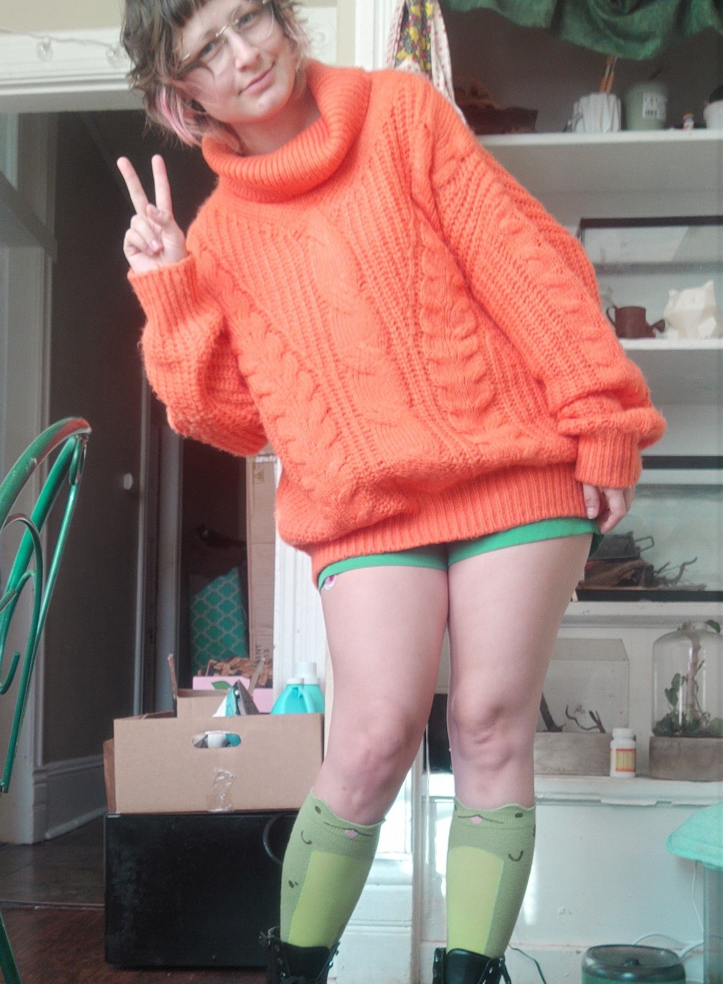 Ootd photo with froggy socks and an oversized orange sweater