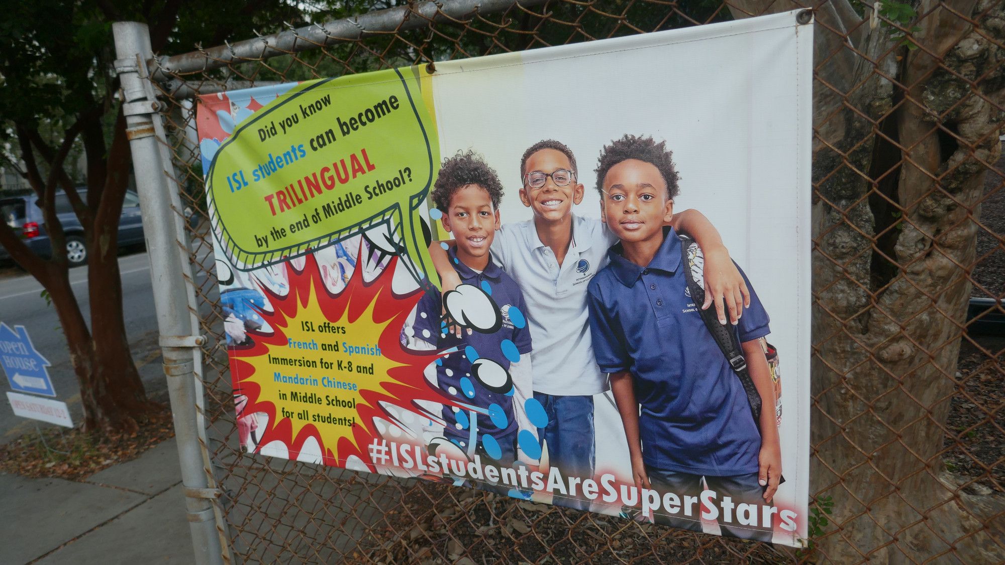 Advertisement for the International School of Louisiana: "Did you know ISL students can become TRILINGUAL by the end of Middle School? ISL offers French and Spanish immersion for K-8 and Mandarin Chinese in Middle School for all students."