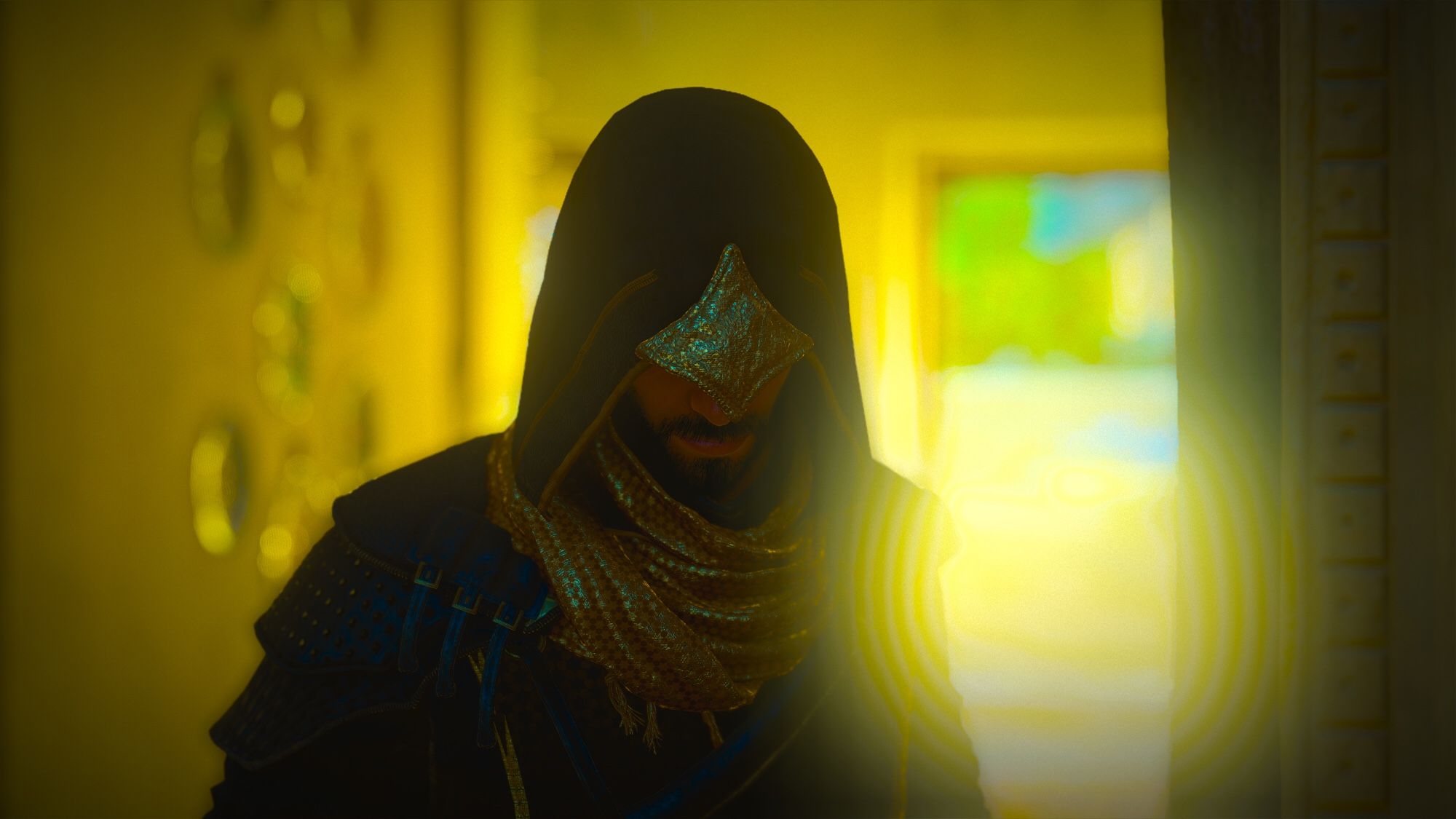 Basim on black and gold robes, framed by saturated yellow and green light, glinting off of him in shadow. Decorations on the wall glitter and a doorway behind glows. I love how jewel-like the light is here.