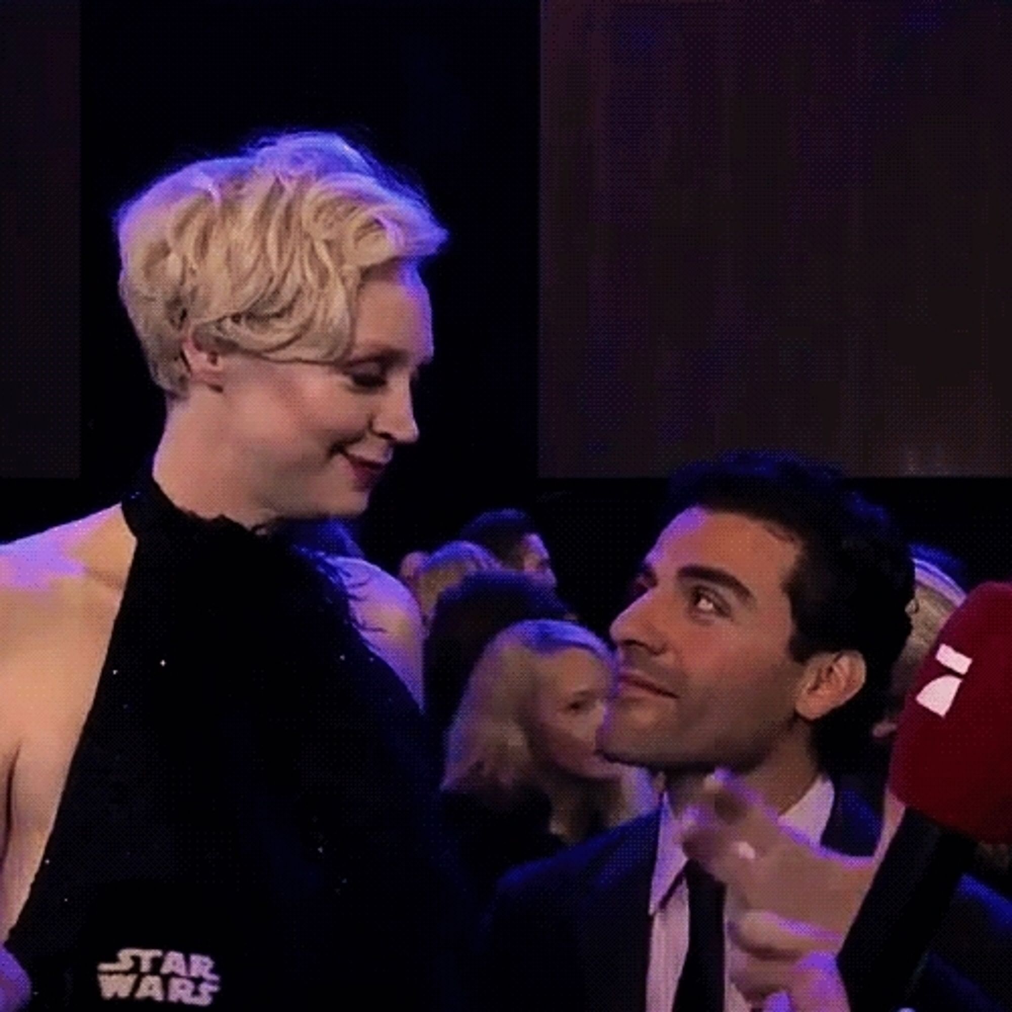 gwendoline christie and oscar isaac sharing a mischievous grin and a *look* while doing a red carpet interview for whichever star wars movie, he comes up to about her shoulders and was just talking to the interviewer about being at the perfect boob height