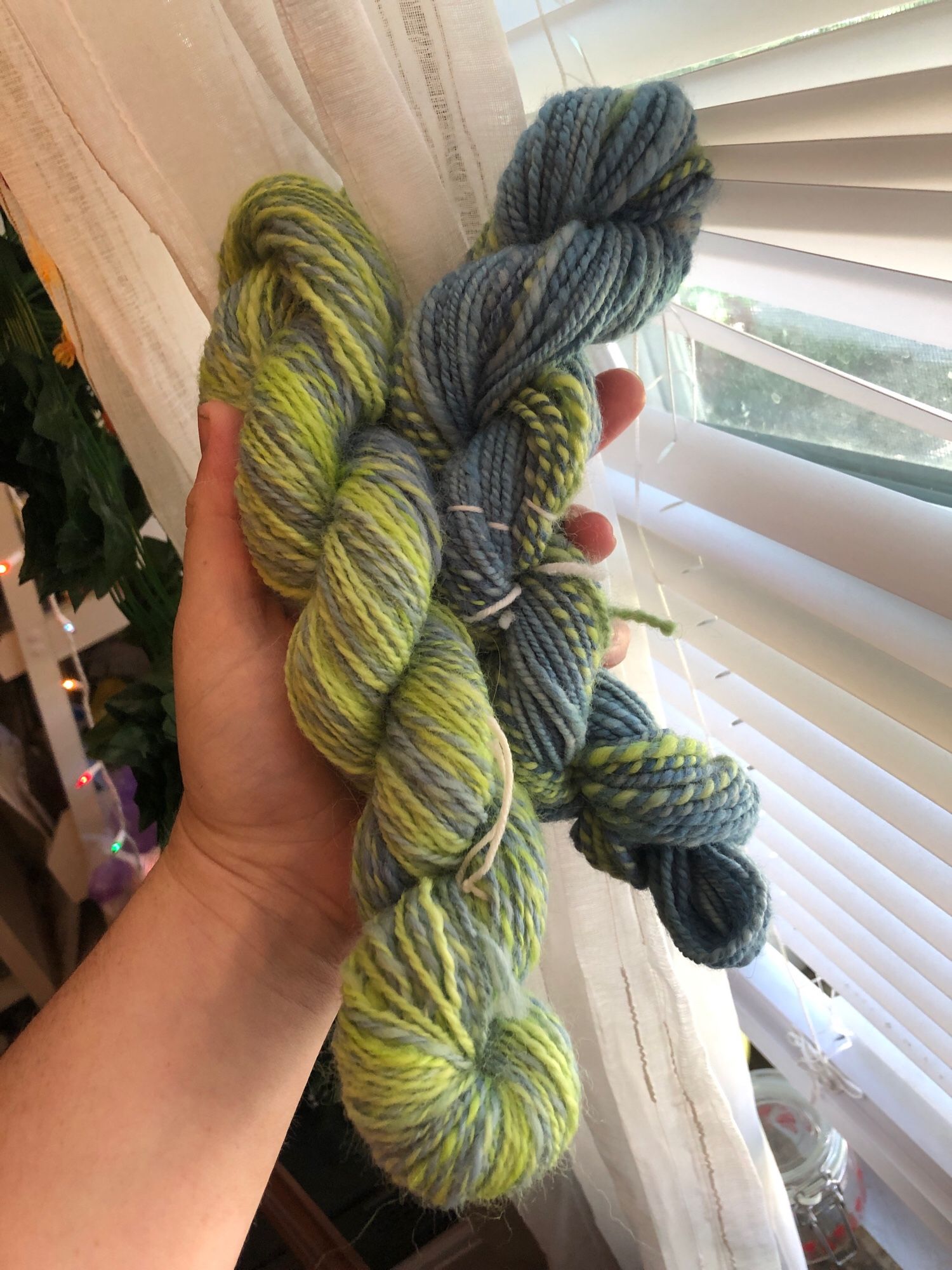 The same yarn held against my window 