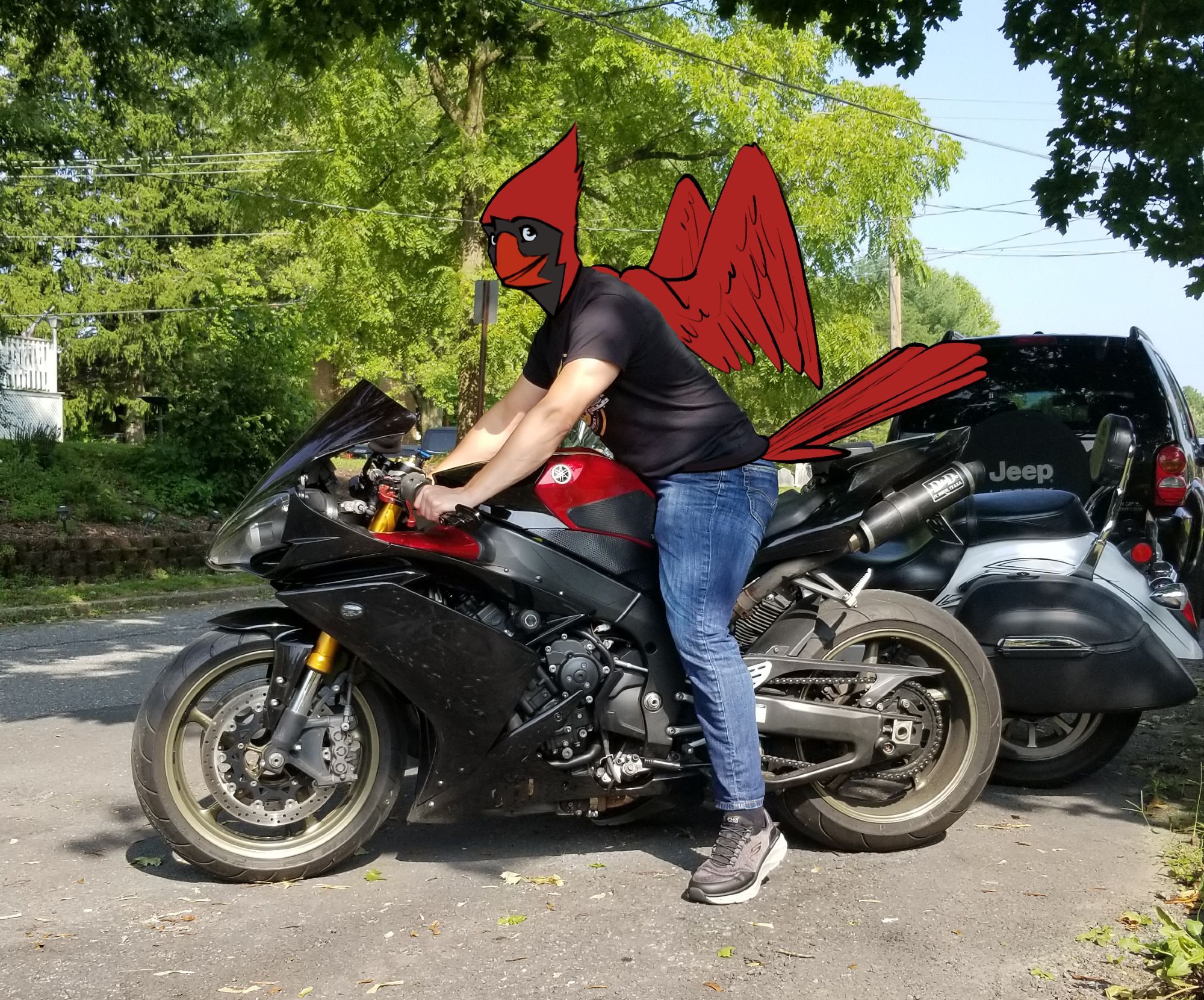 Pulsar sitting on a 2008 Yamaha R1 motorcycle. The pic is a draw-over: a photograph of Pulsar (the person) on the motorcycle with Pulsar (the character) drawn on top of him.