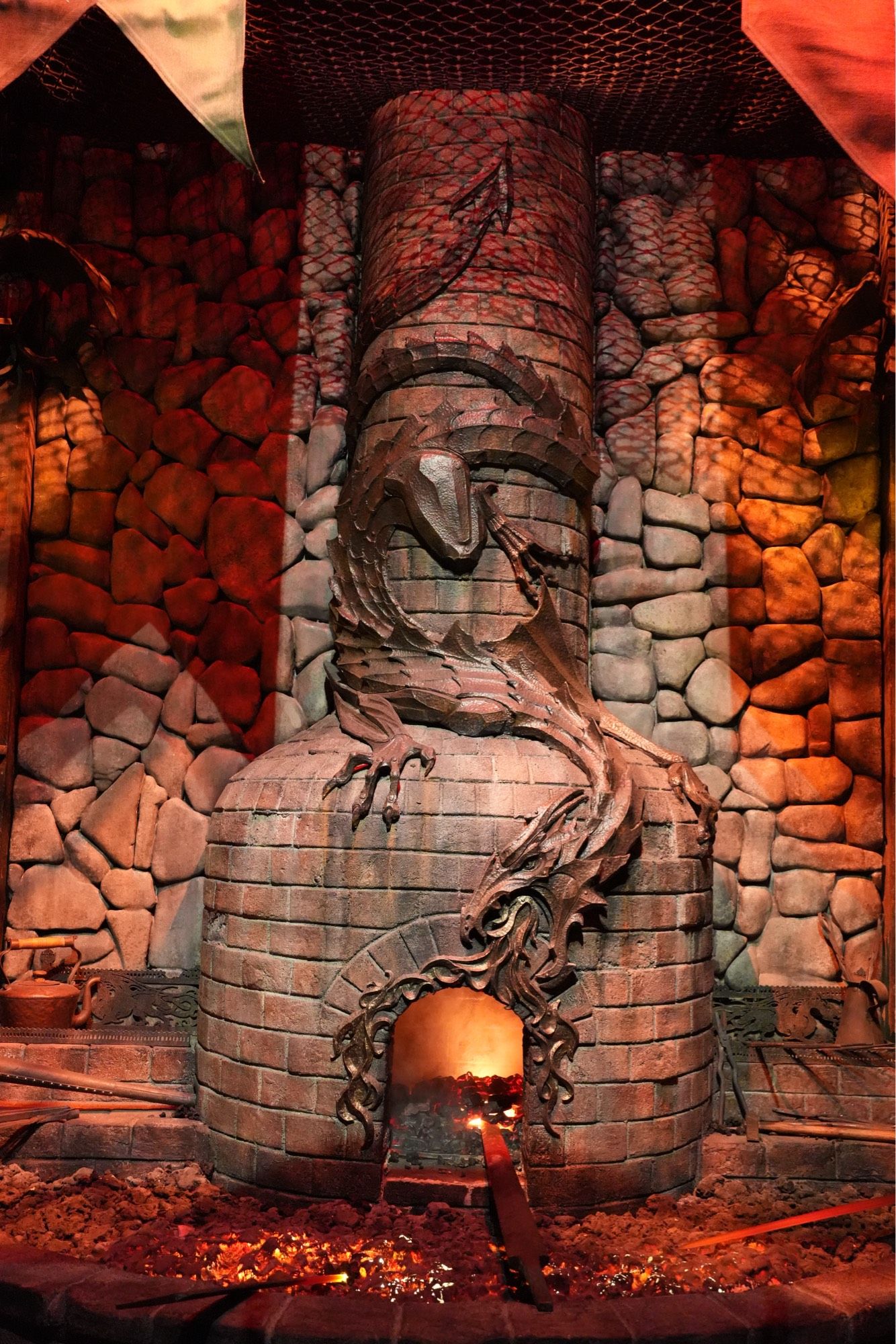 A blacksmiths chimney with ornate dragon decoration