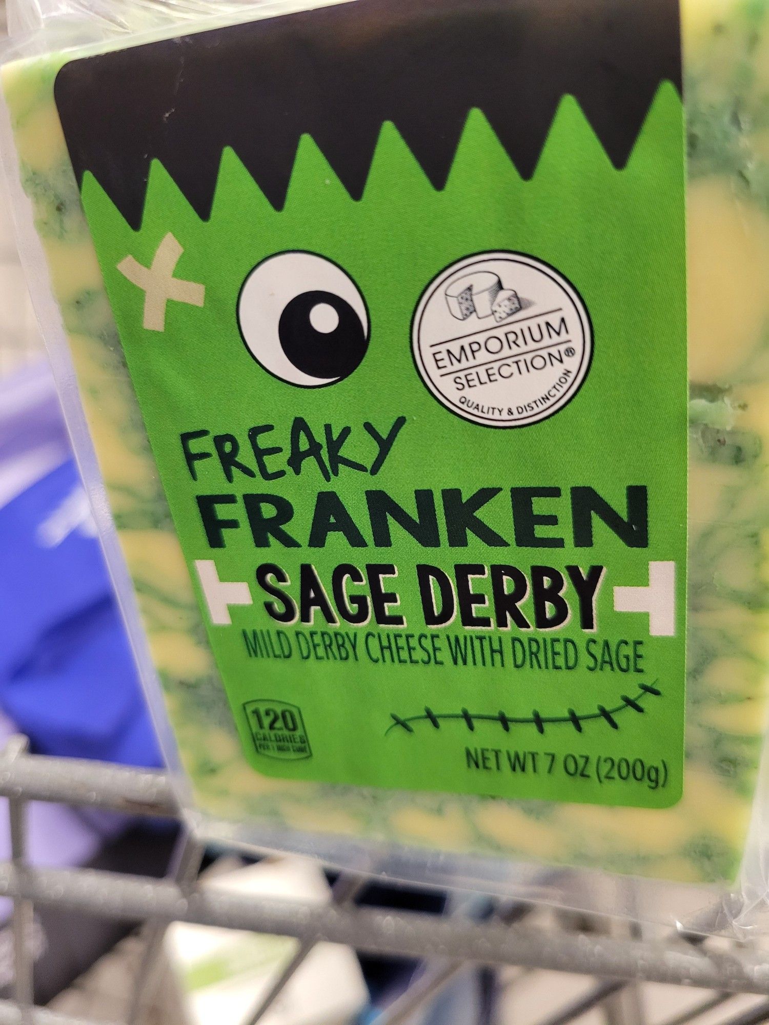 Cheese from Aldi. Label has a Frankenstein picture. Called "Freaky Franken Sage Derby" - mild derby cheese with dried sage. Creamy colored with green lines running through it.