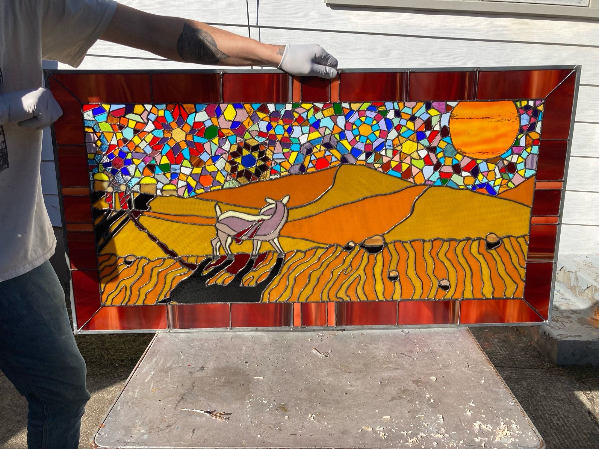 Goat in desert stained glass