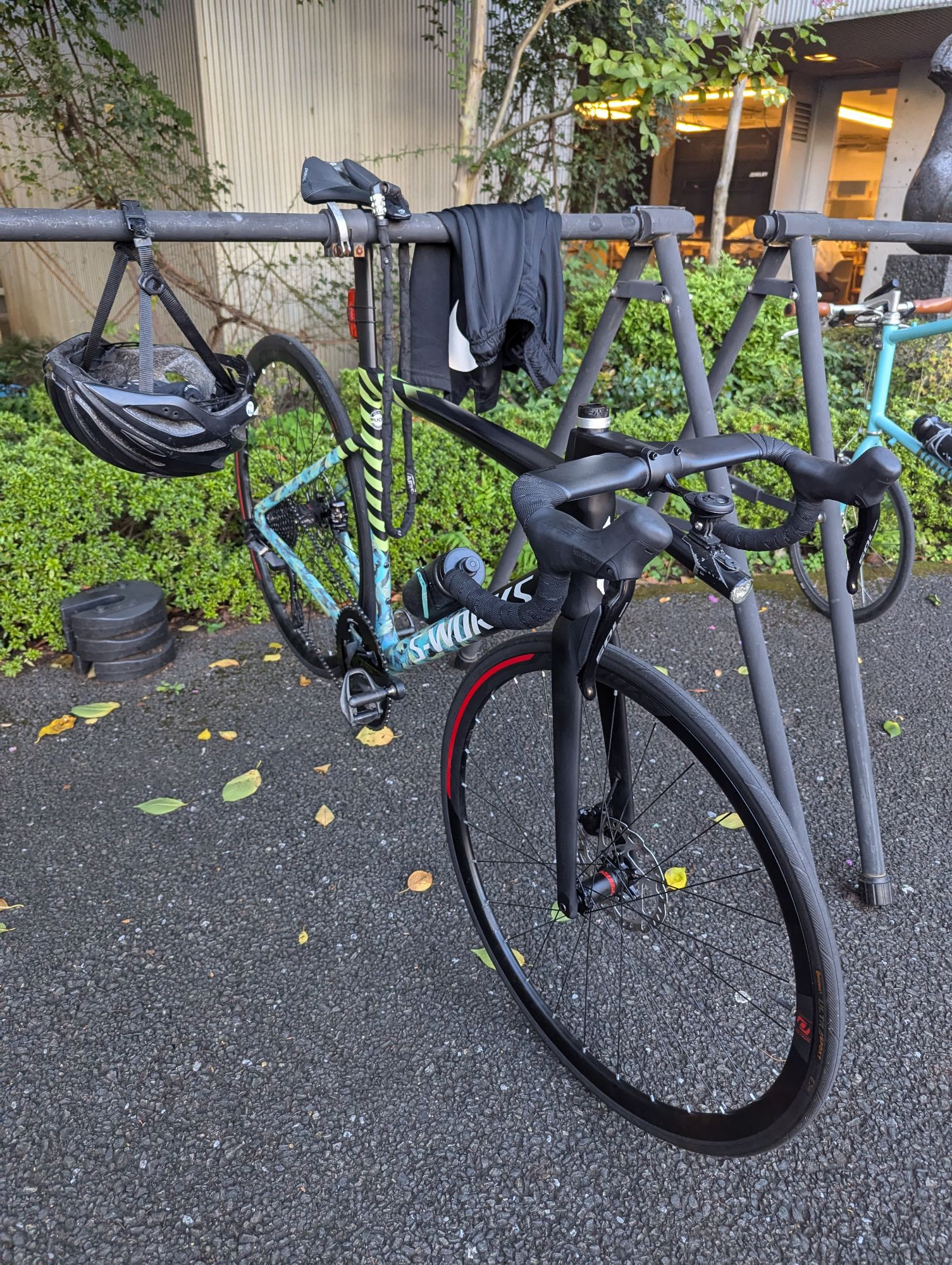 Custom painted S-works road bikes with a mix of different stripped and psychedelic patterns. Appears to be fully carbon with aero fork and handlebars. This bike was at the Tokyo College of Cycle Design.