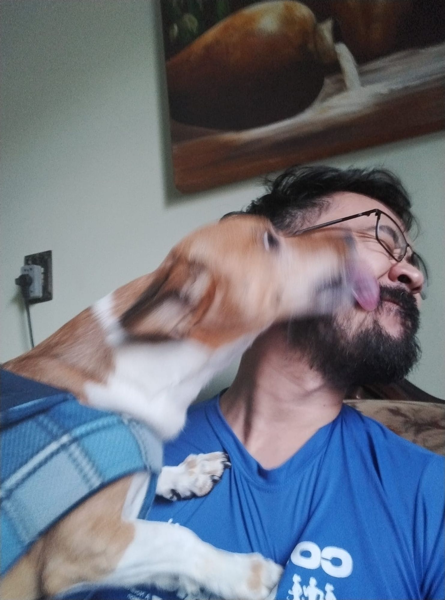 A blurry photo of me getting my face licked by my dog