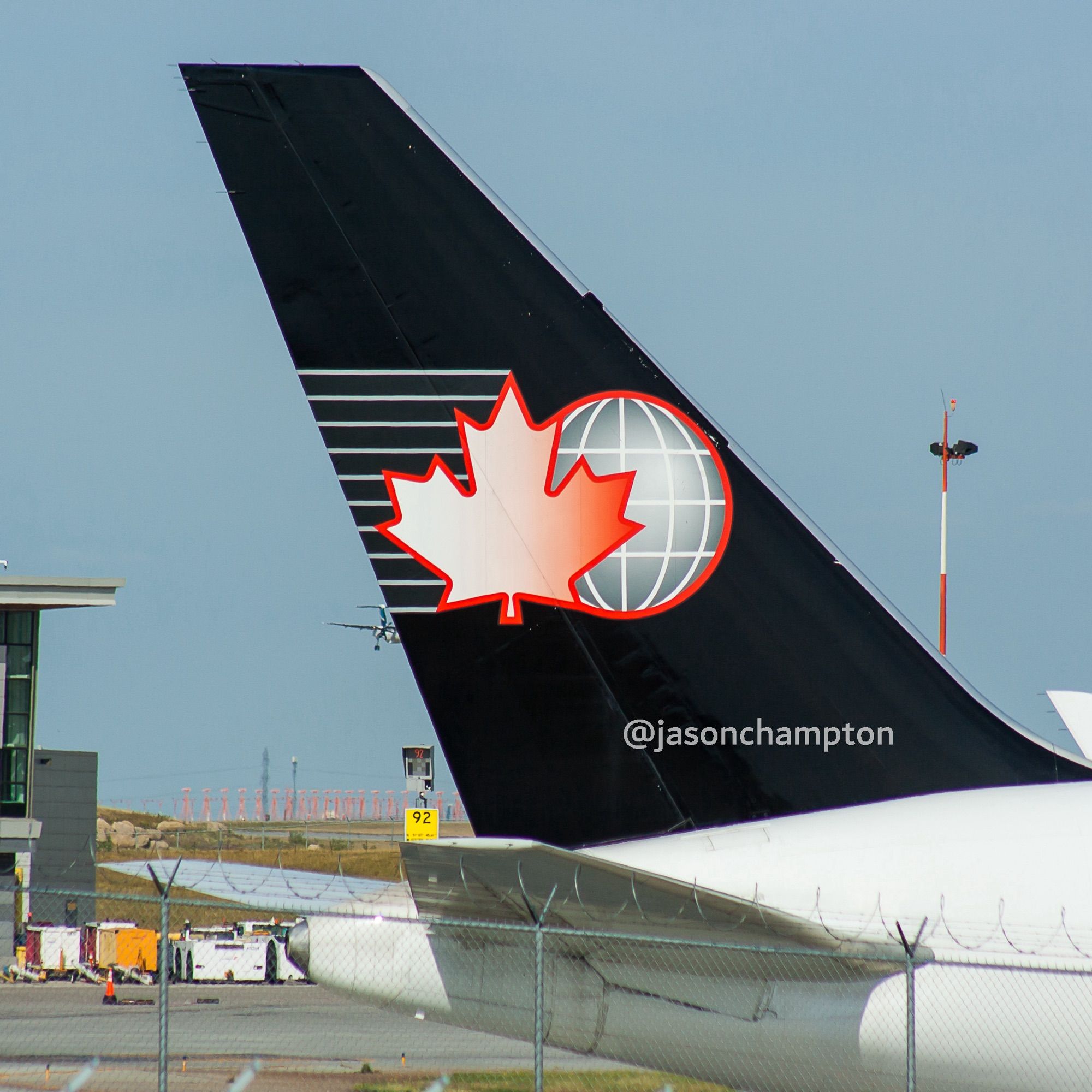 The black tail of a freight jetliner featuring the red and white Cargojet Airways maple leaf logo