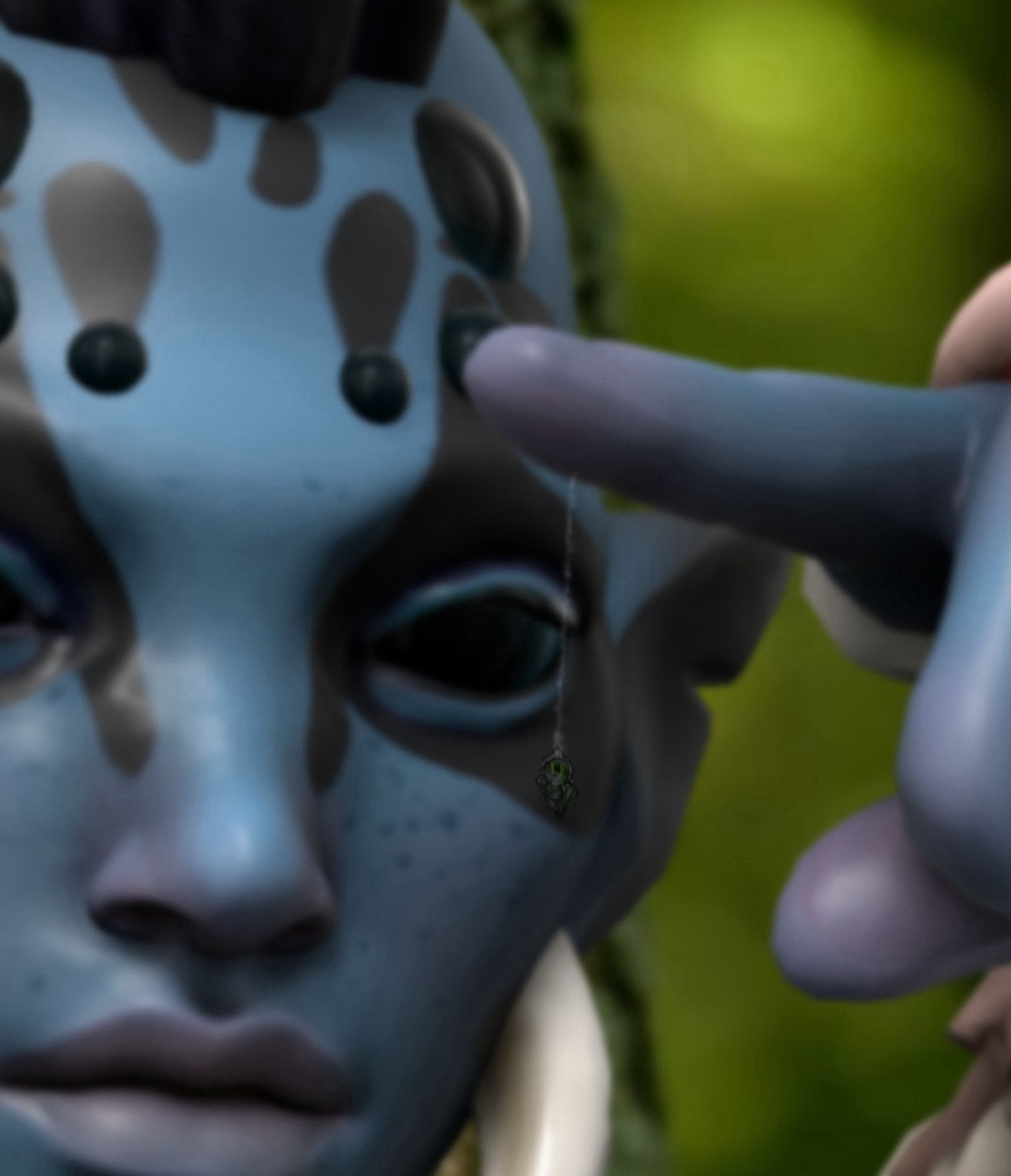 A zoomed in image of a 3D model face with dark eyes, spider-like fangs and spider-like eyes on her forehead. Her skin is blue with dark freckles and black splotches on her face. She is holding out one finger and focusing on a small, green and black spider hanging from it by a thin web. The background is blurry and green.