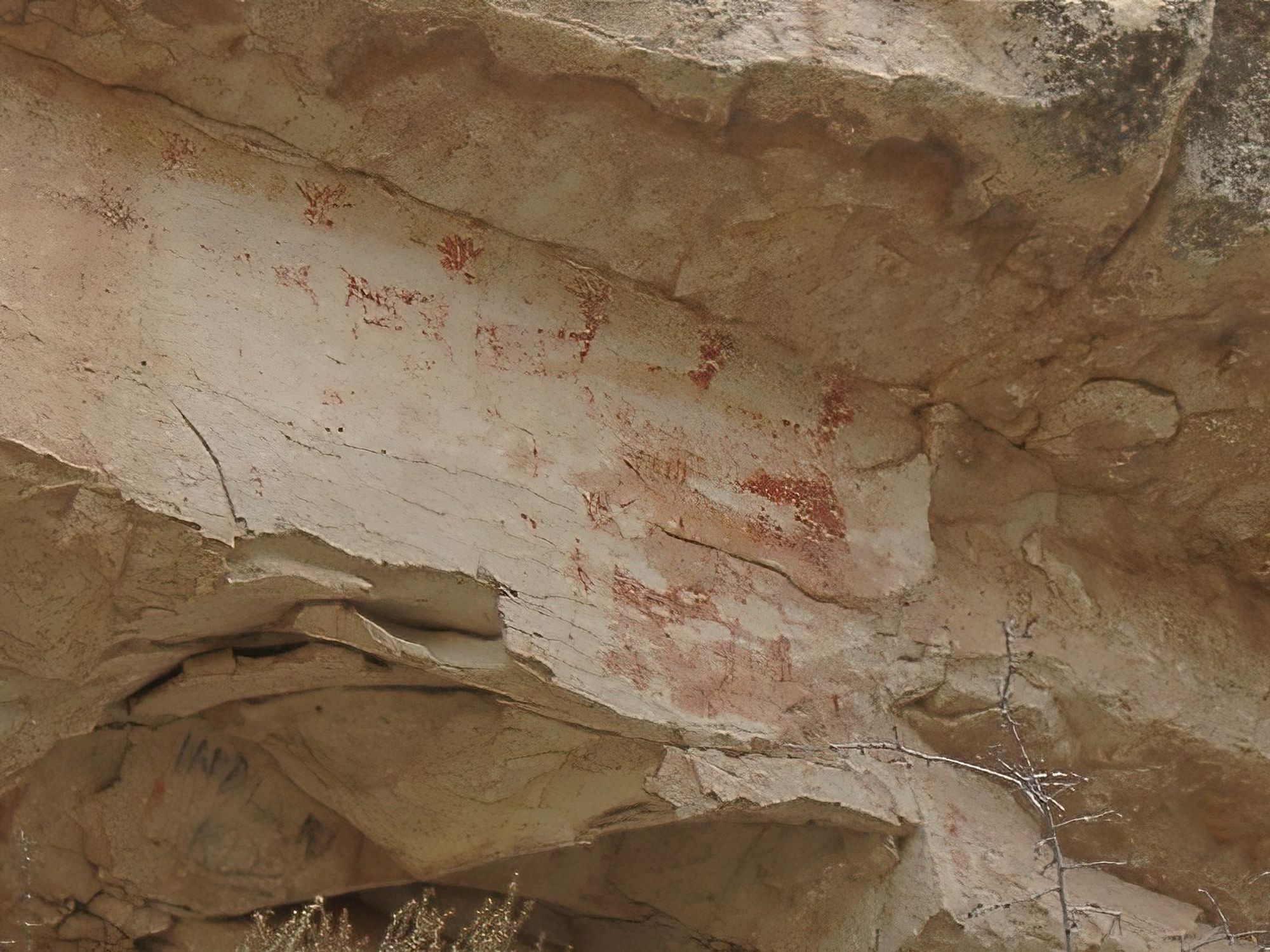 Under a rock ledge is the remnants string of images in red - deer, most likely. No National Park signs point these out to you. You have to find them for yourselves.