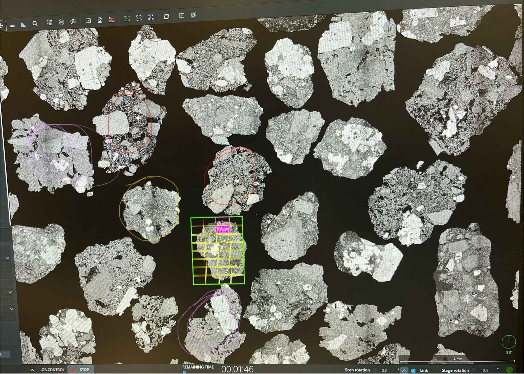 A picture on the scanning electron microscope of lots of tephra, with crystals and bubbles I. From the 2021 eruption of Soufrière, St Vincent.