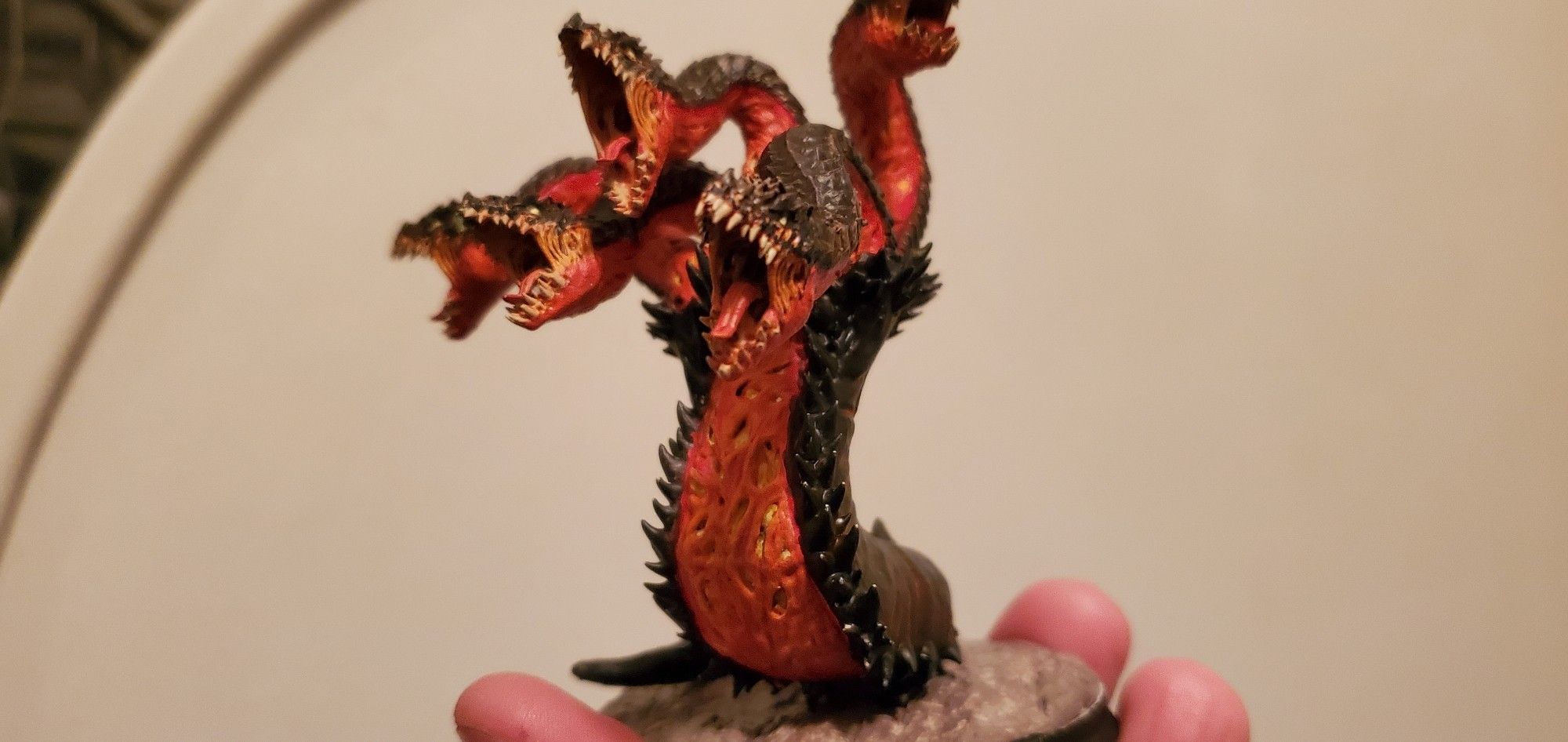 Picture of my painted model Hydra, printed in resin and colored to look like it's crawled out of a volcano.