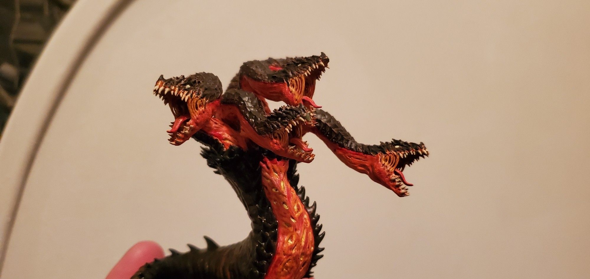 Picture of my painted model Hydra, printed in resin and colored to look like it's crawled out of a volcano.