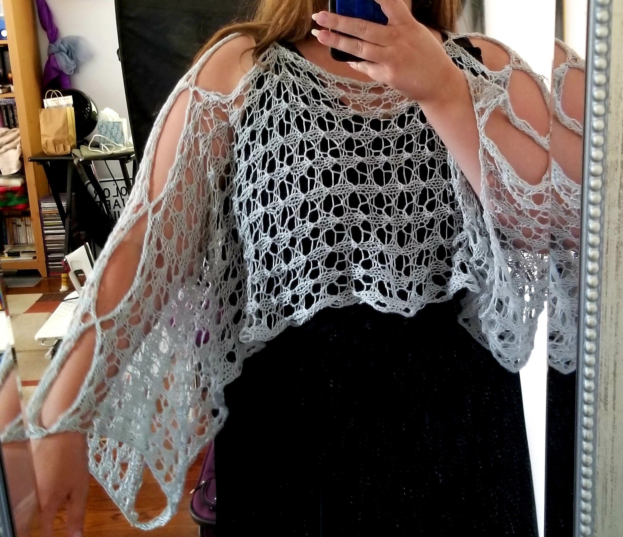 The same grey shawl showing the full garment.