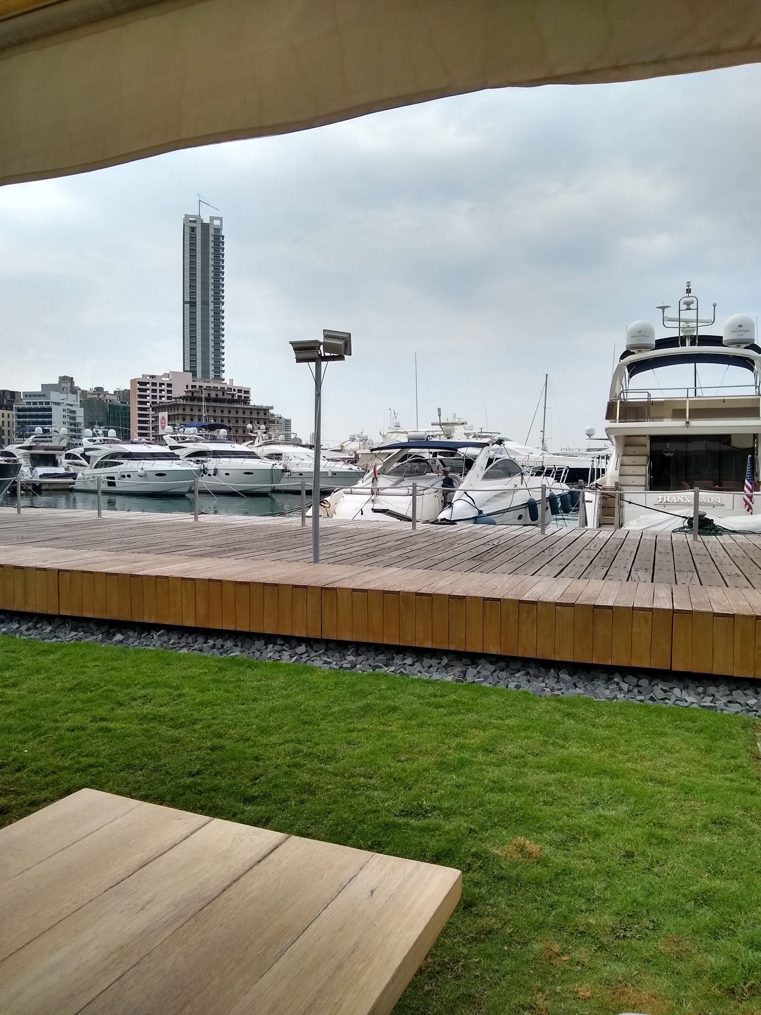 Beirut boardwalk with boats docked at the piers.